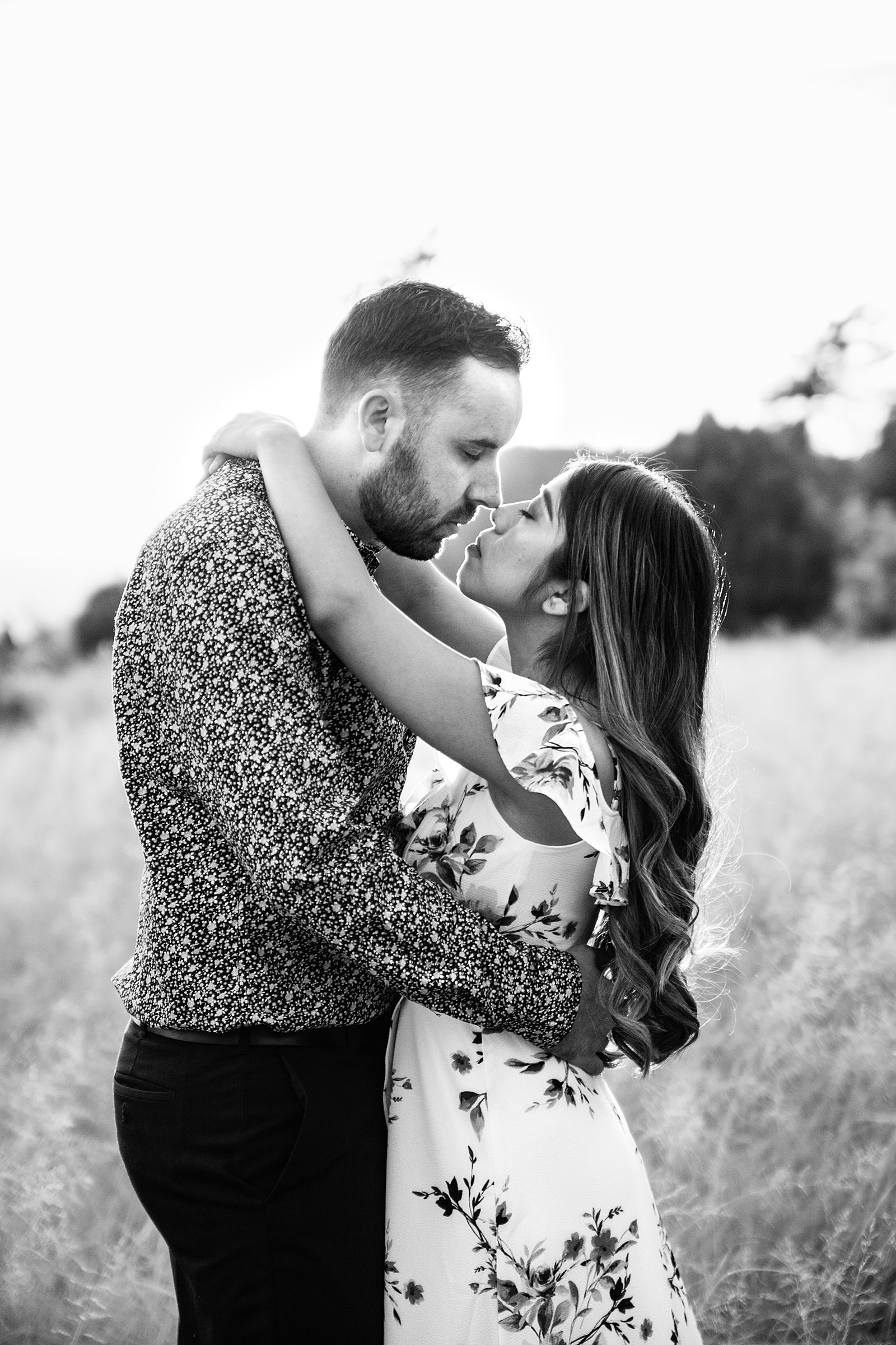 Couple share an intimate moment at their Payson engagement session by Arizona engagement photographer PMA Photography.