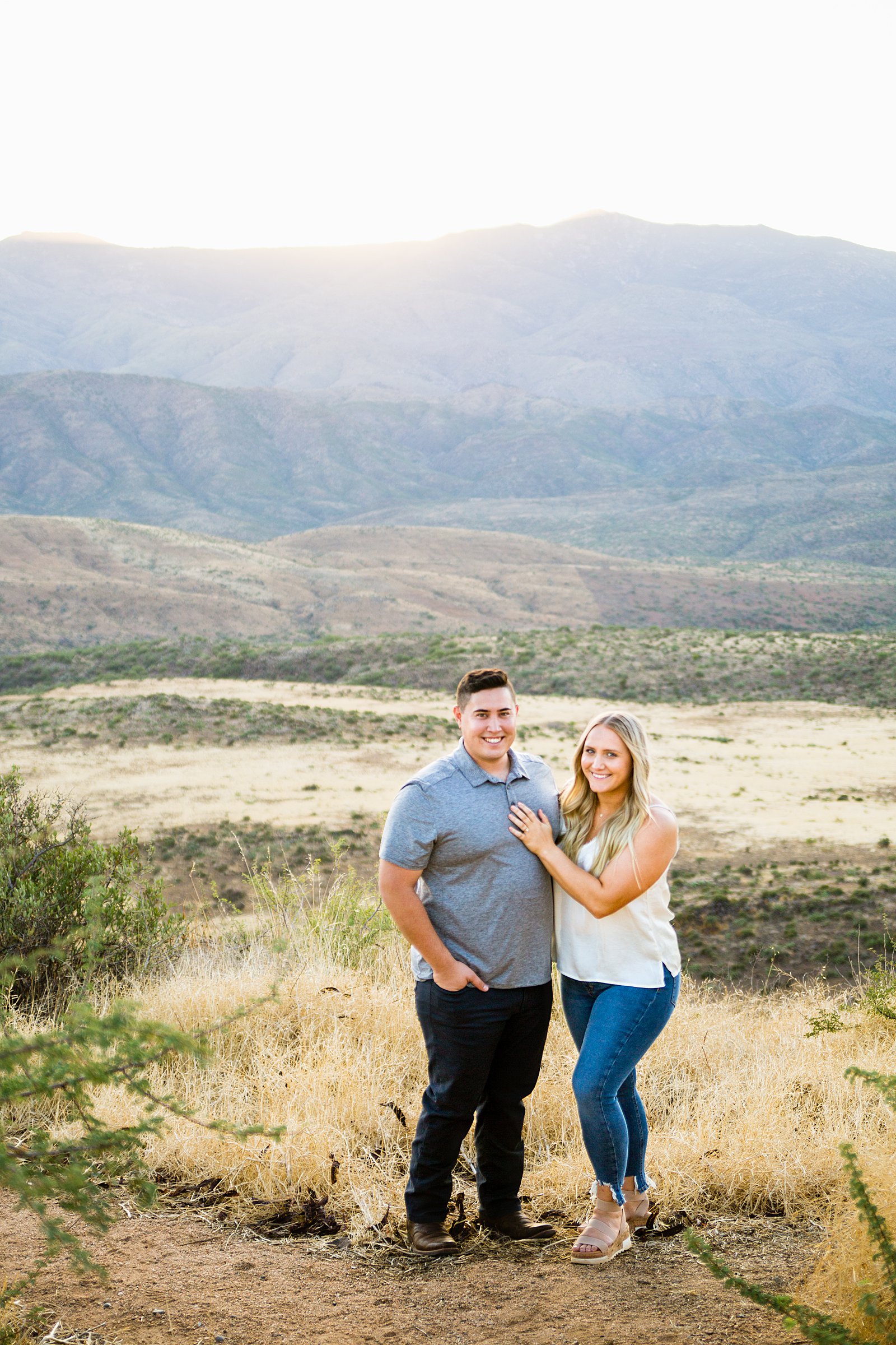 Couple pose for their Sunset Point engagement session by Phoenix wedding photographer PMA Photography.