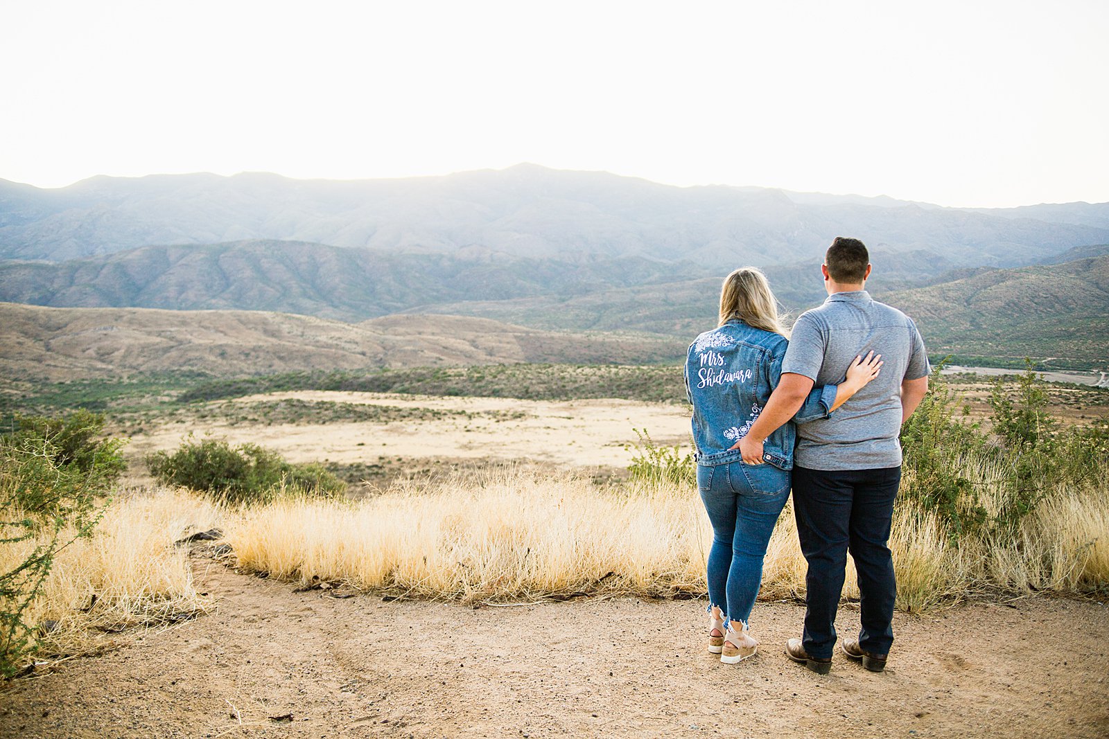 Couple pose for their Sunset Point engagement session by Phoenix wedding photographer PMA Photography.