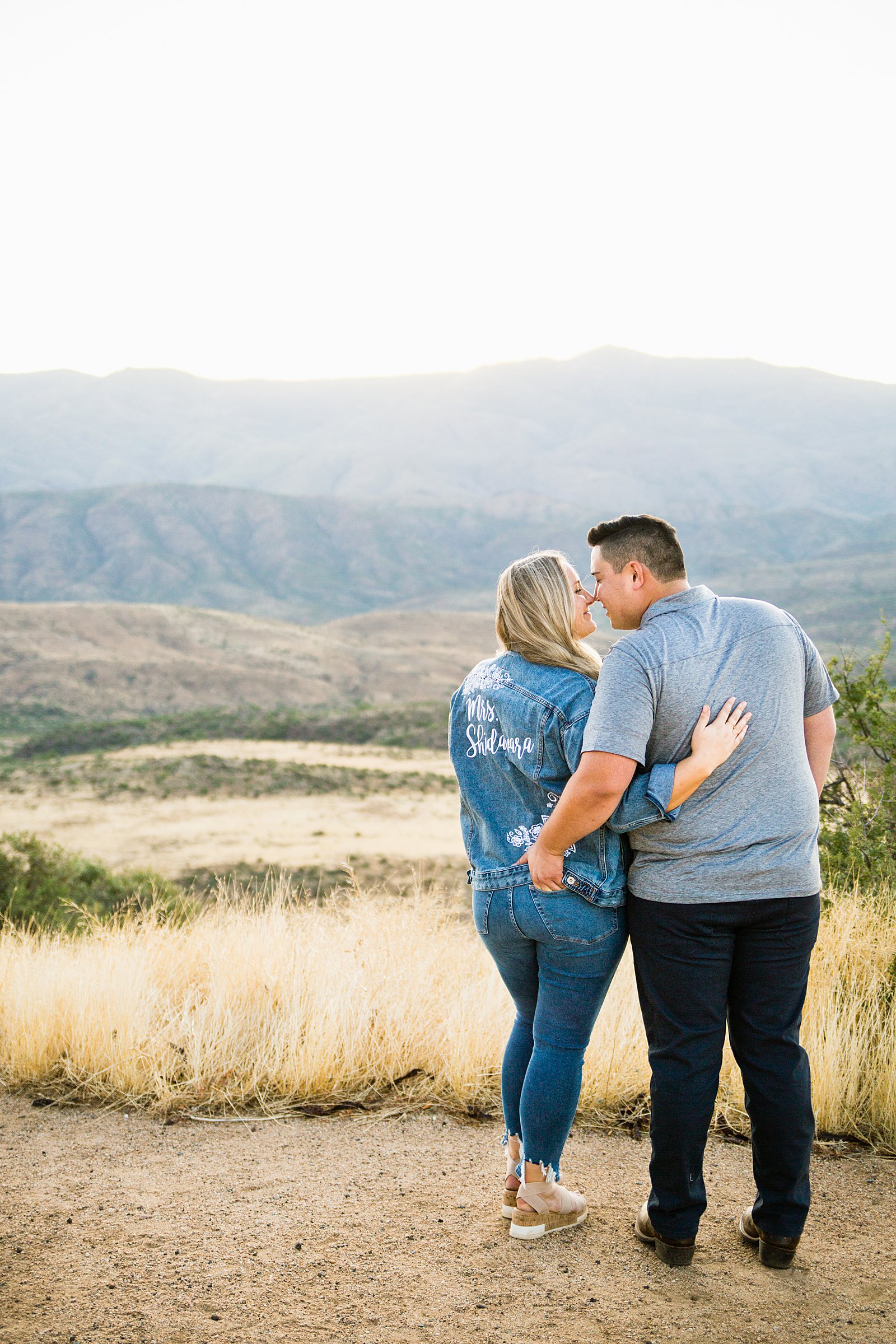 Couple share an intimate moment during their Sunset Point engagement session by Phoenix engagement photographer PMA Photography.