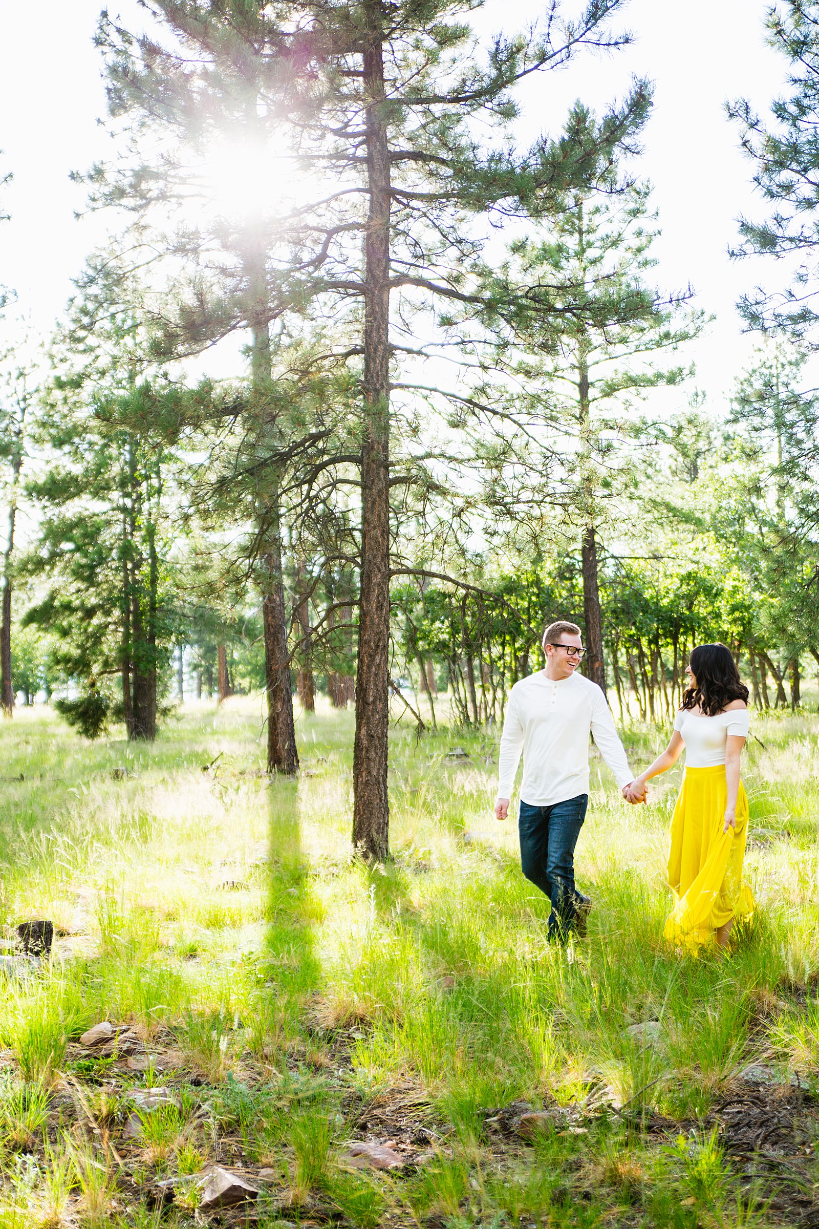 Couple walking together during their Payson engagement session by Arizona engagement photographer PMA Photography.
