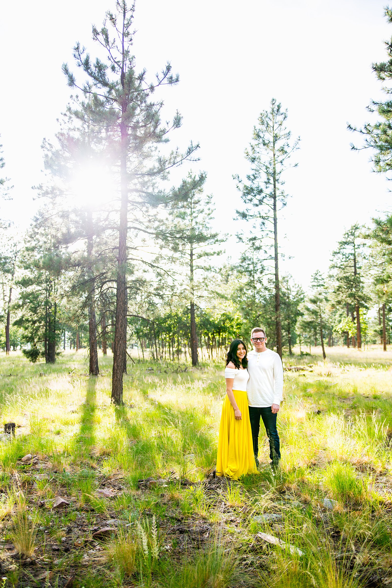 Couple pose during their Payson engagement session by Arizona wedding photographer PMA Photography.