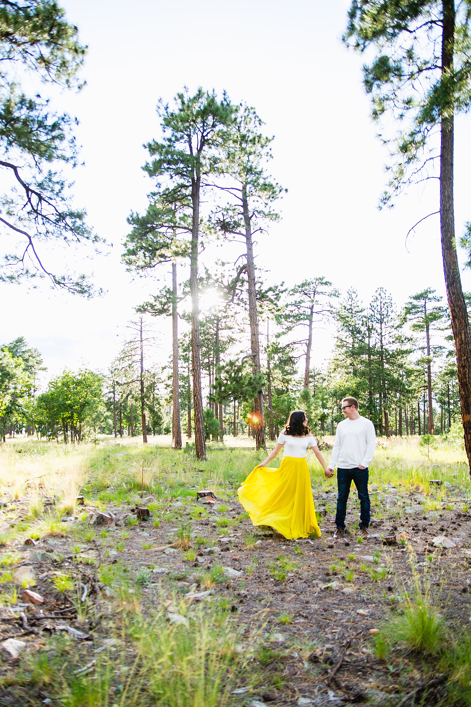 Adventurous couple pose during their Payson engagement session by Arizona wedding photographer PMA Photography.