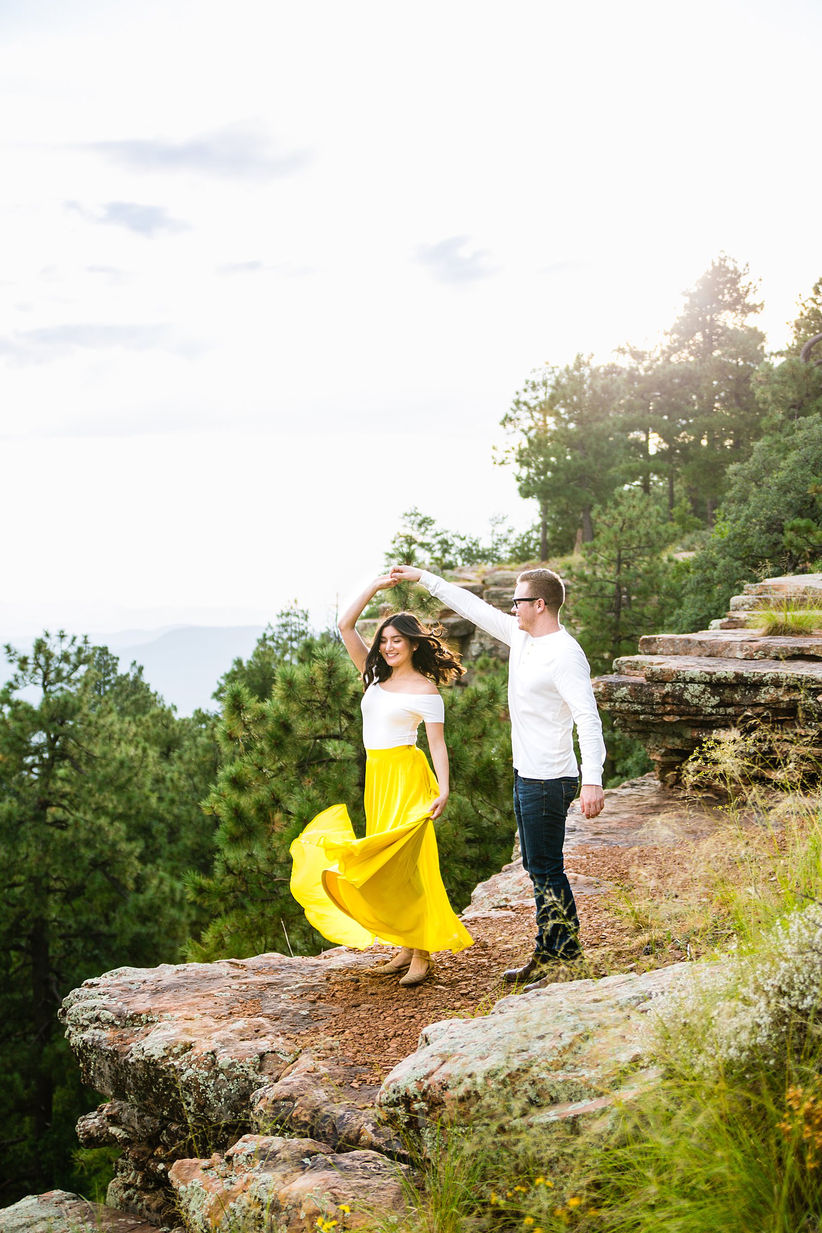 Couple dancing together for their Mogollon Rim engagement session by Payson wedding photographer PMA Photography.