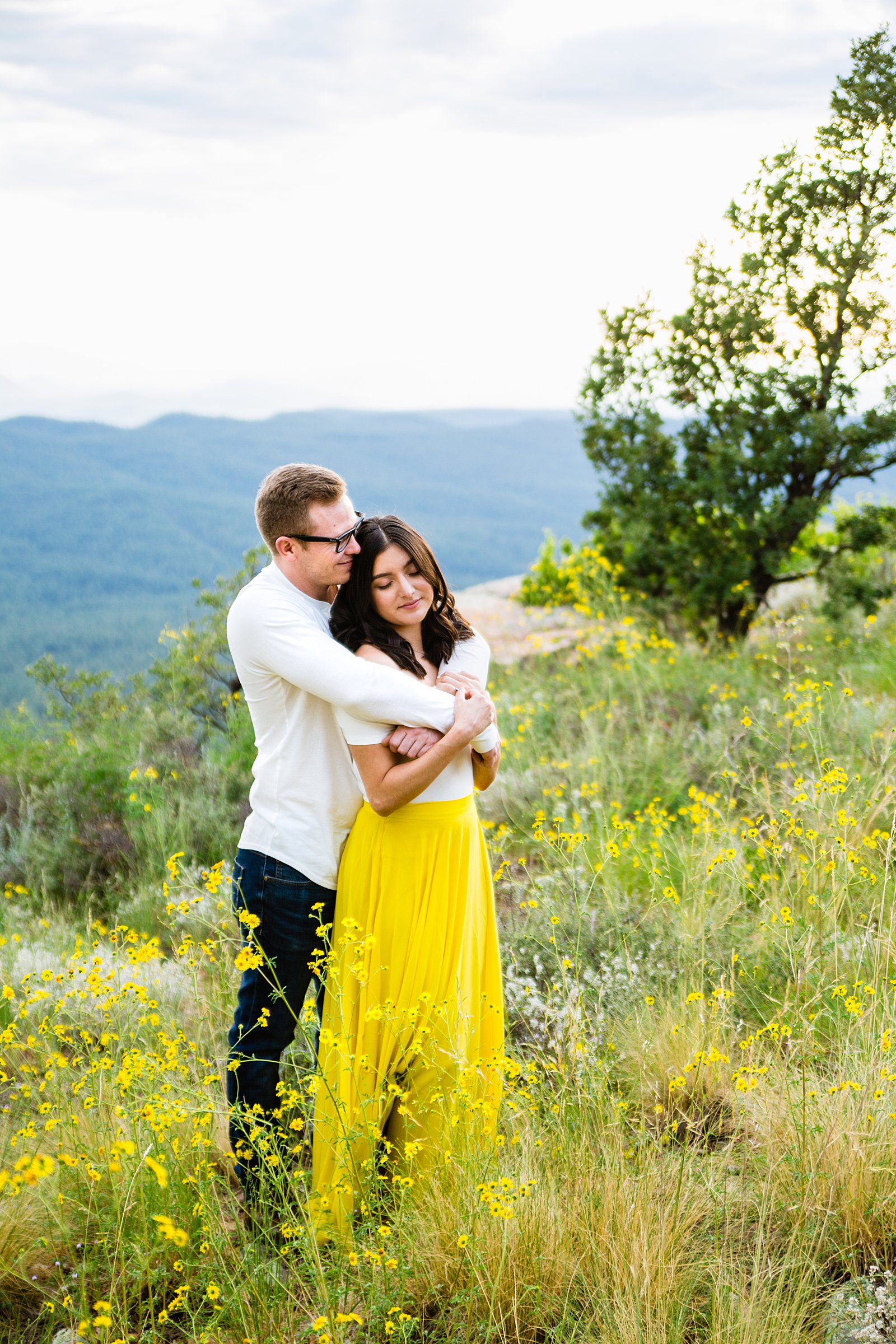 Couple share an intimate moment during their Mogollon Rim engagement session by Payson engagement photographer PMA Photography.