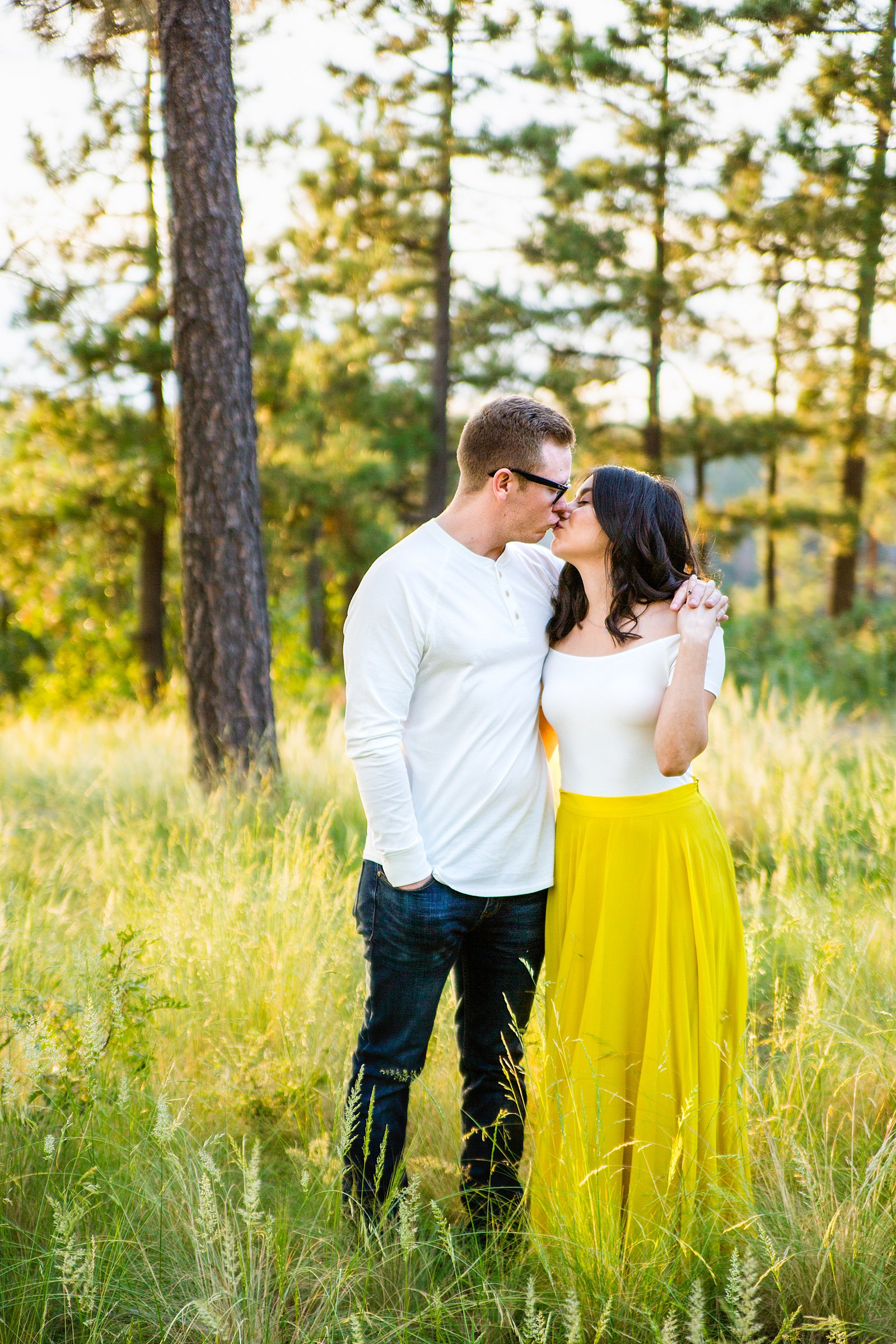 Couple share a kiss during their Payson engagement session by Arizona wedding photographer PMA Photography.