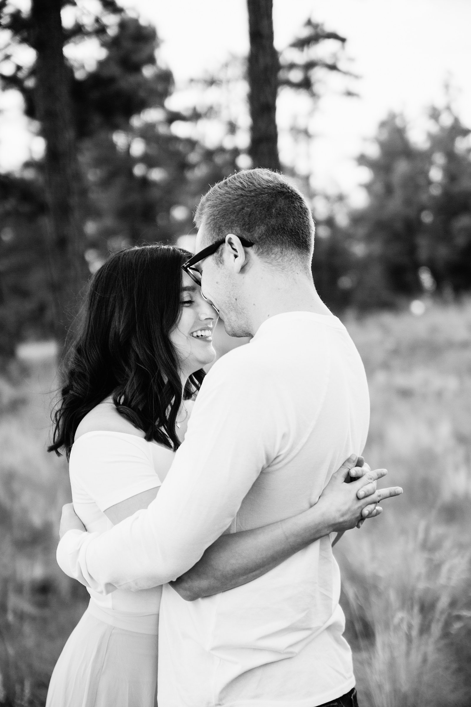 Couple share an intimate moment at their Payson engagement session by Arizona engagement photographer PMA Photography.