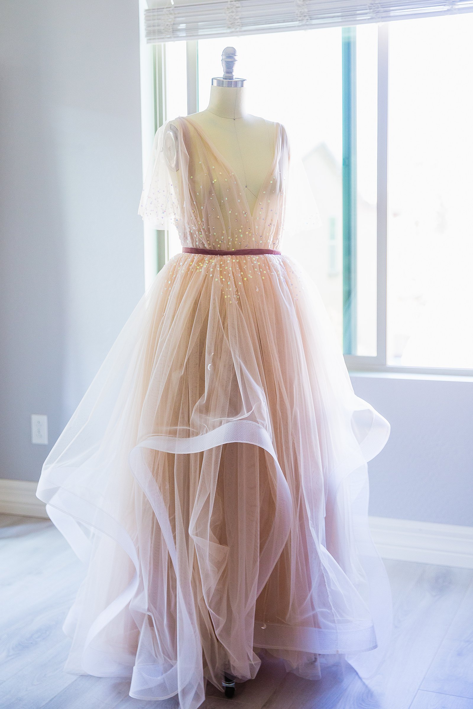 Bride's unique pink wedding dress for her Cloth and Flame Superstition Mountain wedding by PMA Photography.