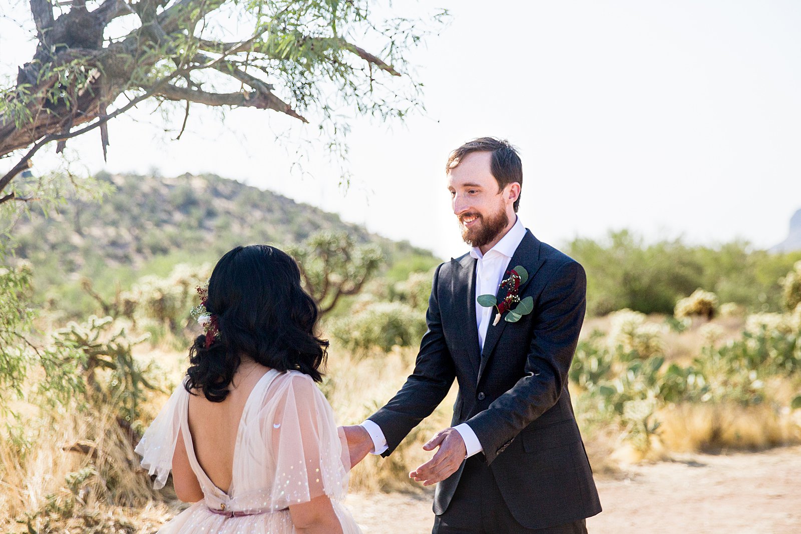 Bride and Groom's first look at Cloth and Flame Superstition Mountain by Phoenix wedding photographer PMA Photography.