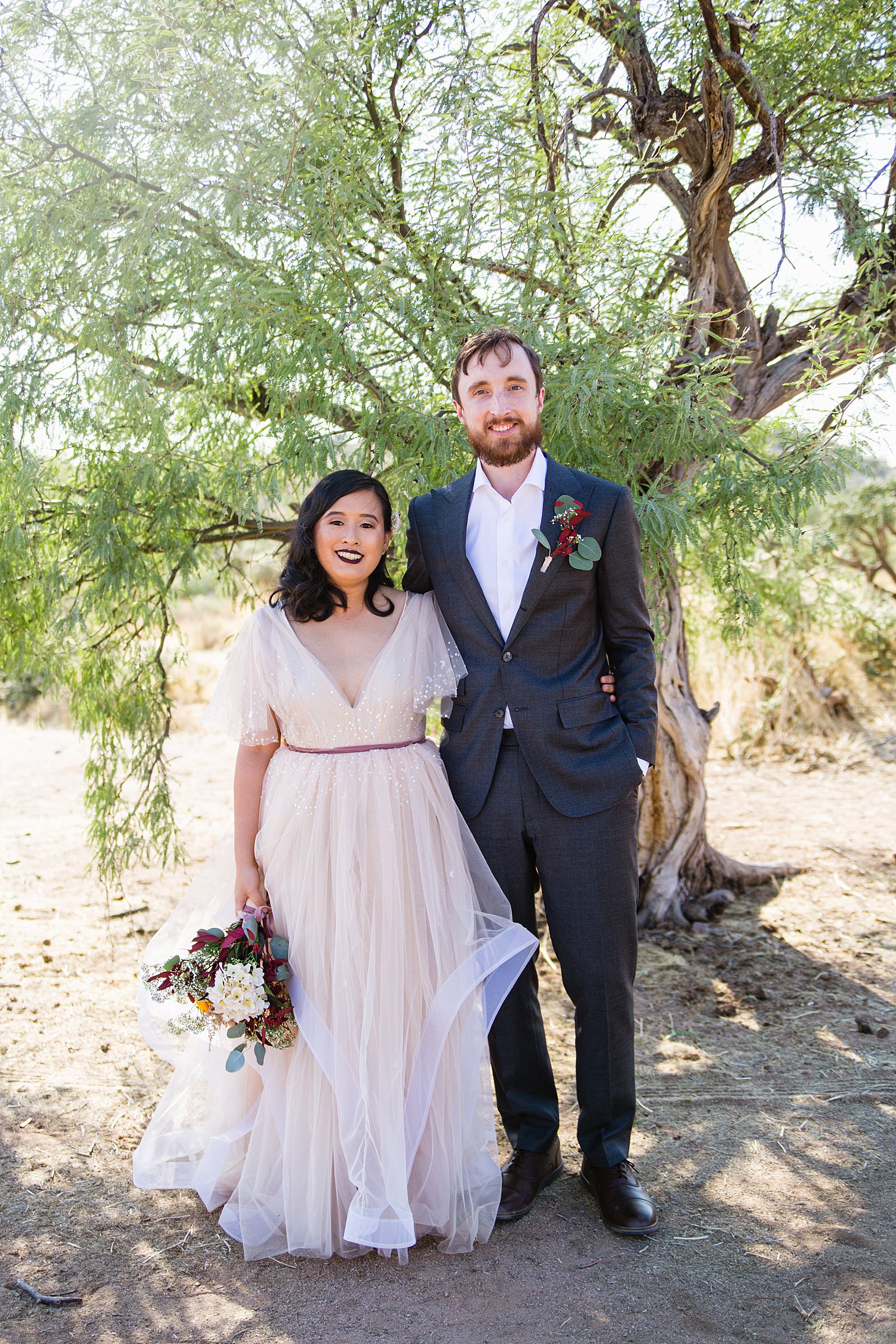 Bride and Groom pose during their Cloth and Flame Superstition Mountain wedding by Arizona wedding photographer PMA Photography.
