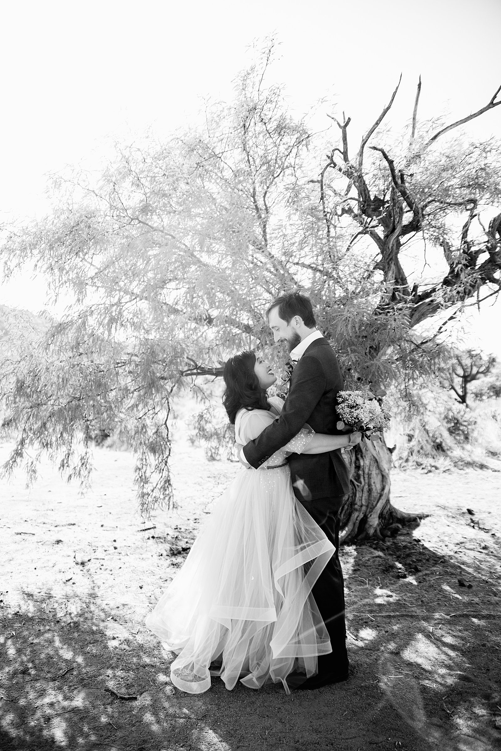 Bride and Groom share an intimate moment at their Cloth and Flame Superstition Mountain wedding by Arizona wedding photographer PMA Photography.