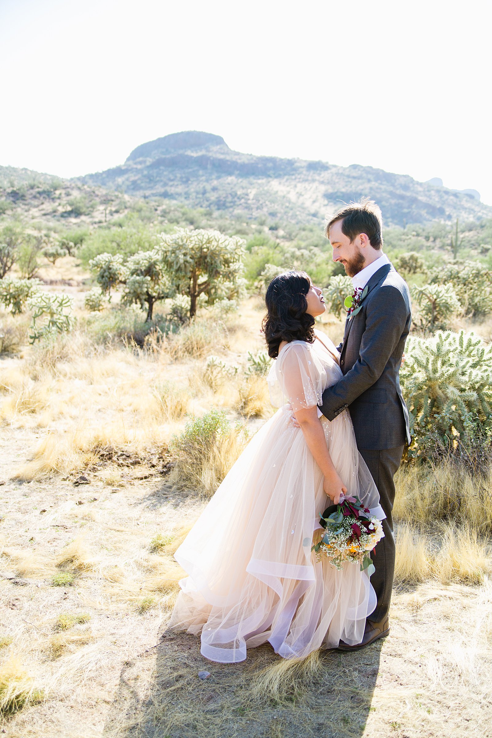 Bride and Groom pose during their Cloth and Flame Superstition Mountain wedding by Arizona wedding photographer PMA Photography.