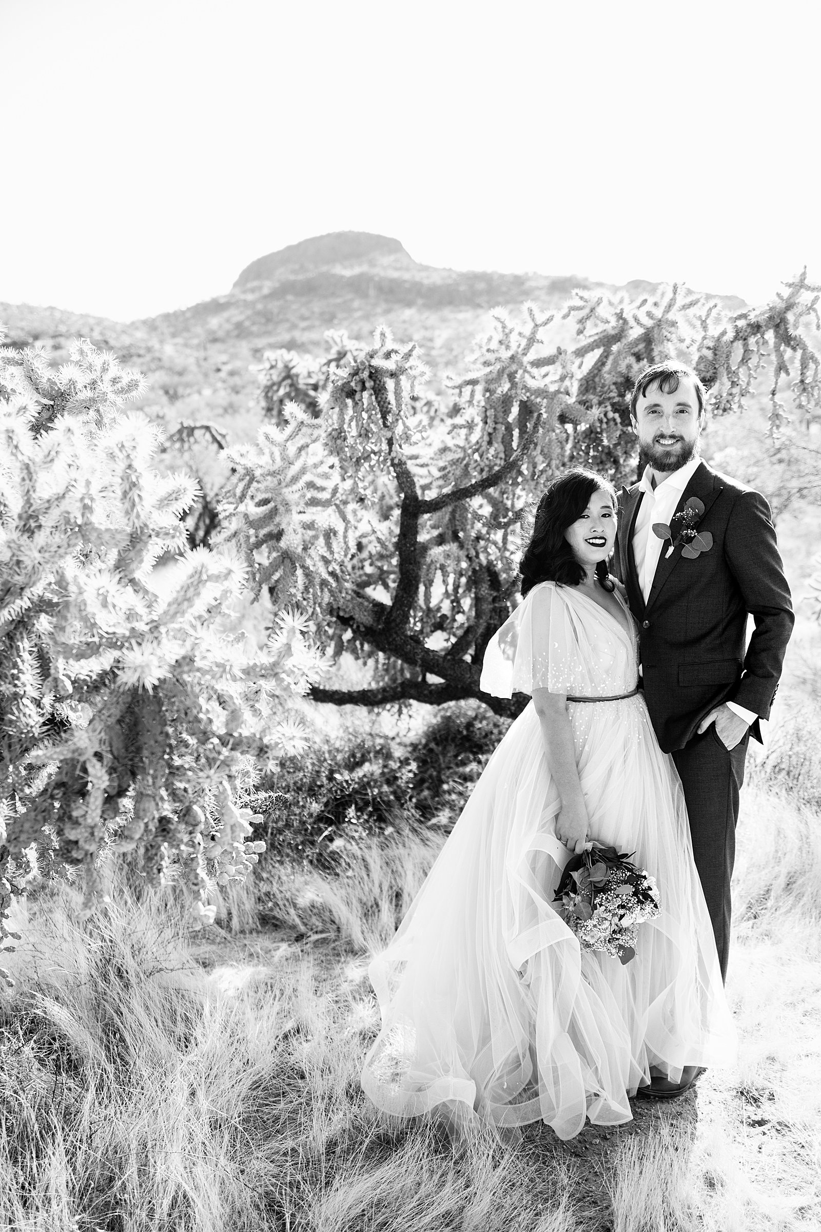 Bride and Groom pose for their Cloth and Flame Superstition Mountain wedding by Mesa wedding photographer PMA Photography.