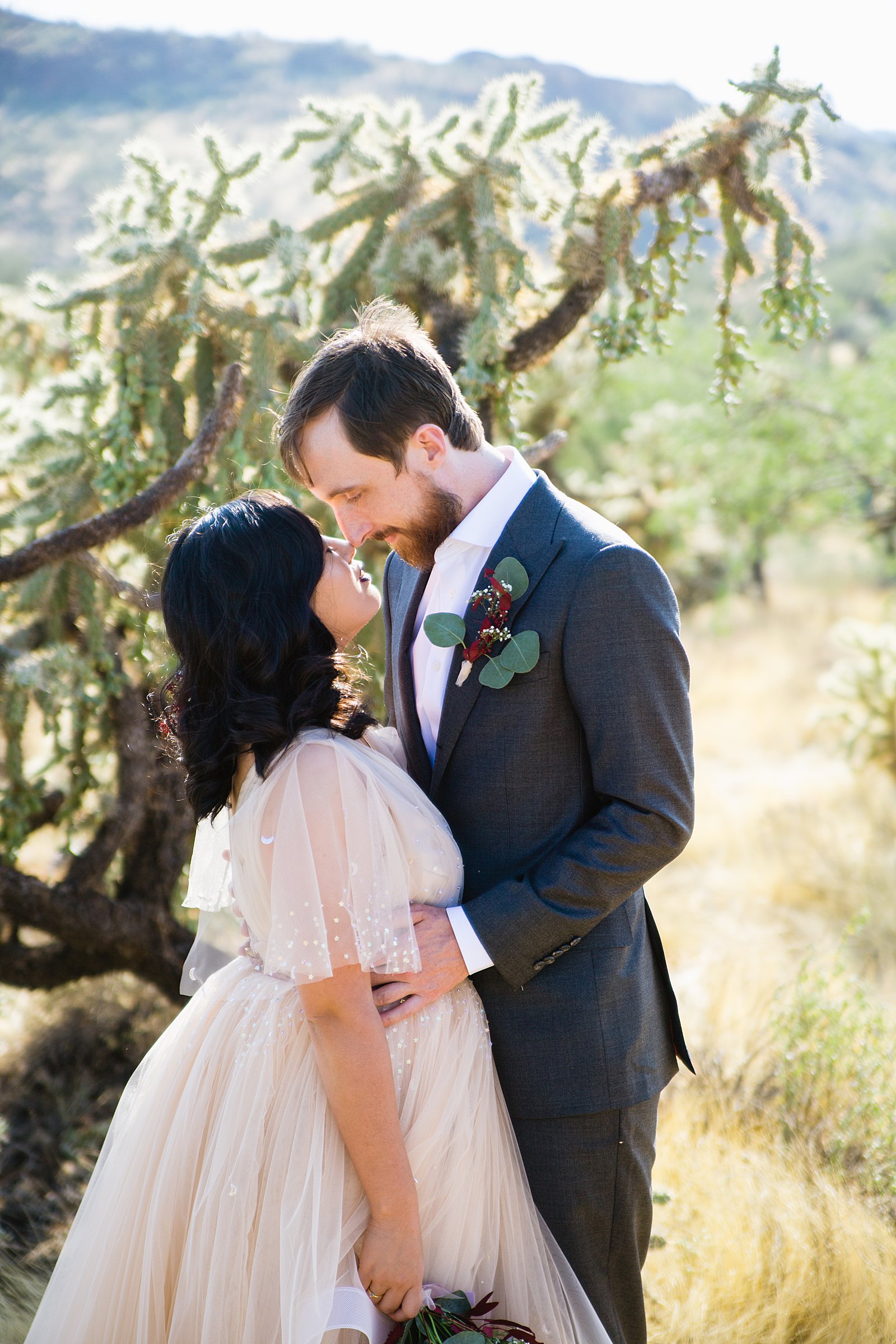Bride and Groom share an intimate moment at their Cloth and Flame Superstition Mountain wedding by Arizona wedding photographer PMA Photography.