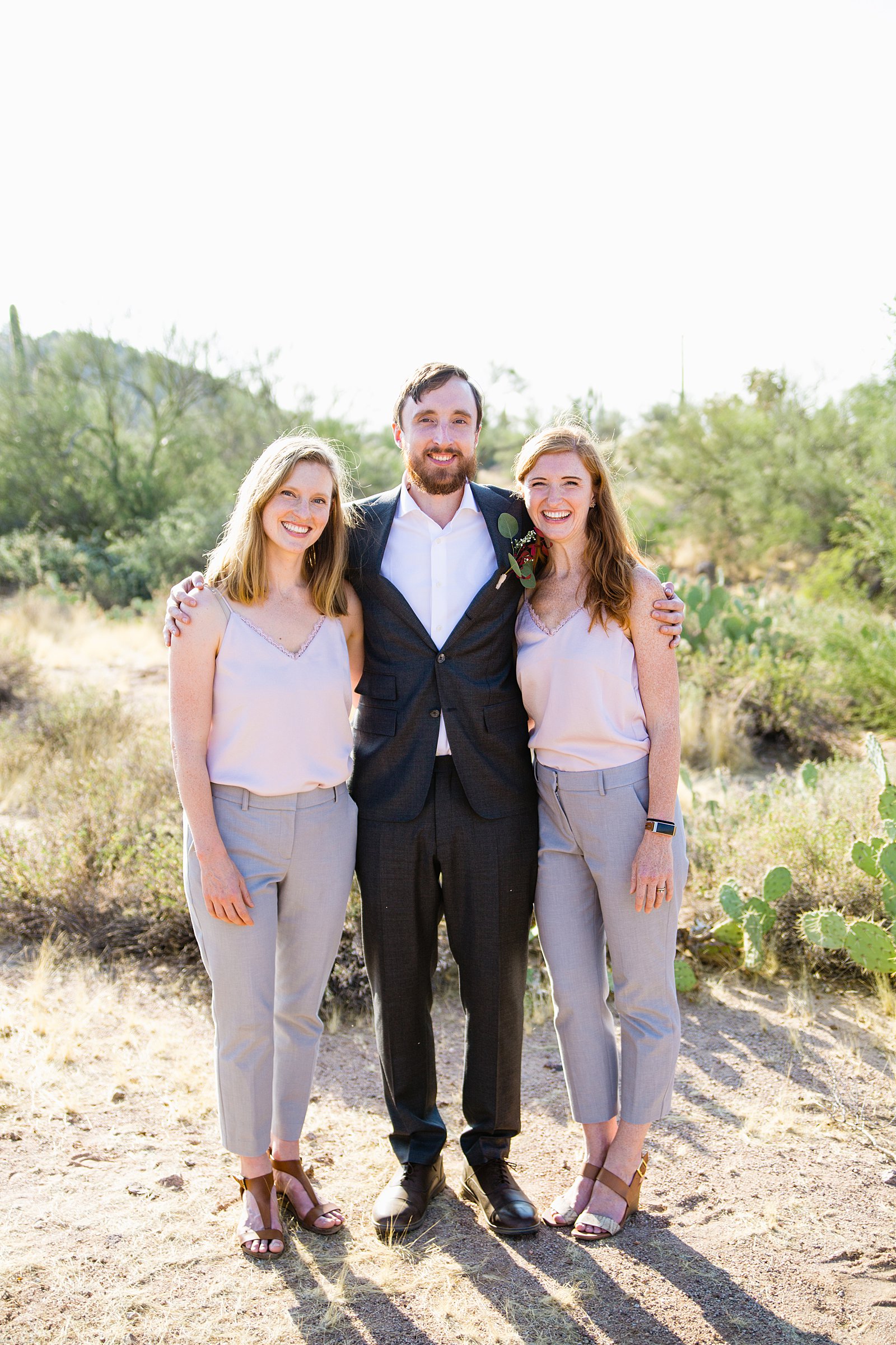 Groom and mixed gender bridal party together at a Cloth and Flame Superstition Mountain wedding by Arizona wedding photographer PMA Photography.