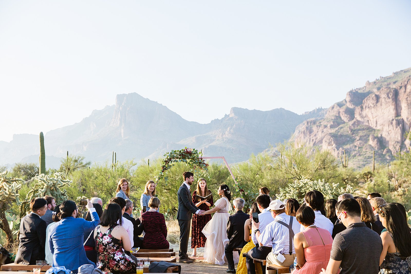 Wedding ceremony at a Cloth and Flame wedding in the Superstition Mountains by Phoenix wedding photographer PMA Photography.