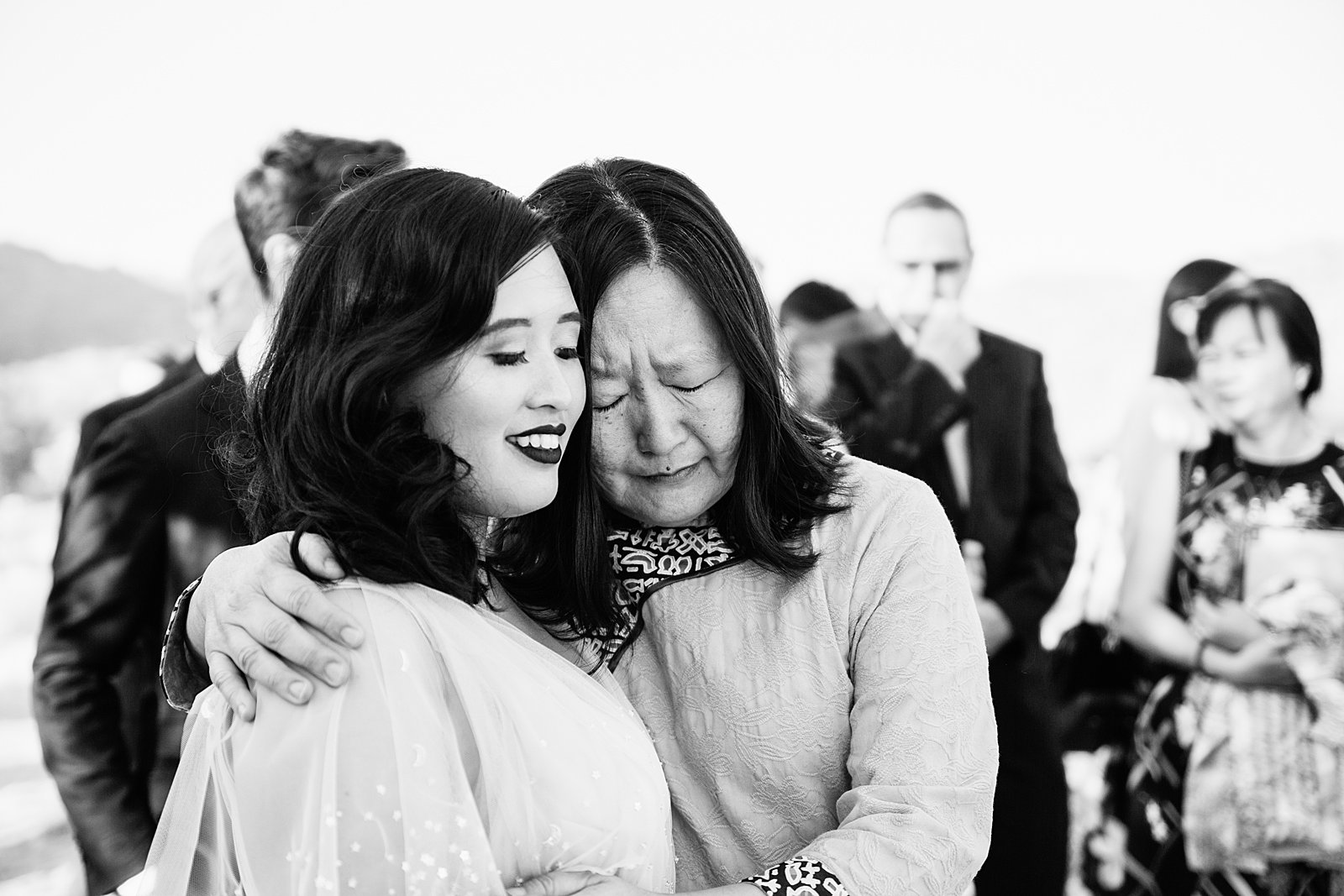 An emotional moment with the bride and her mother just after the wedding ceremony by Phoenix wedding photographer PMA Photography.