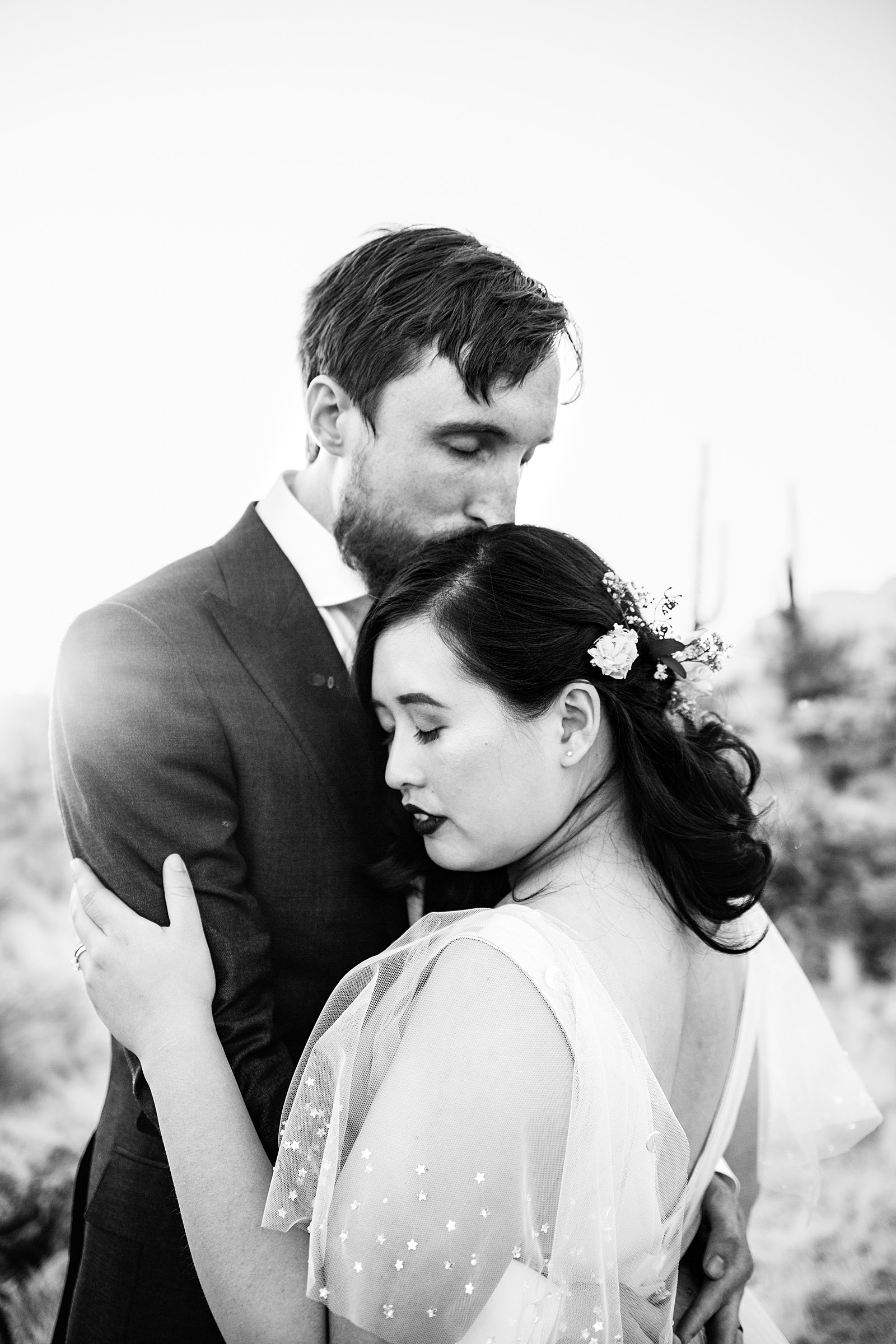 Bride and Groom share an intimate moment at their Superstition Mountain Cloth and Flame wedding by Arizona wedding photographer PMA Photography.