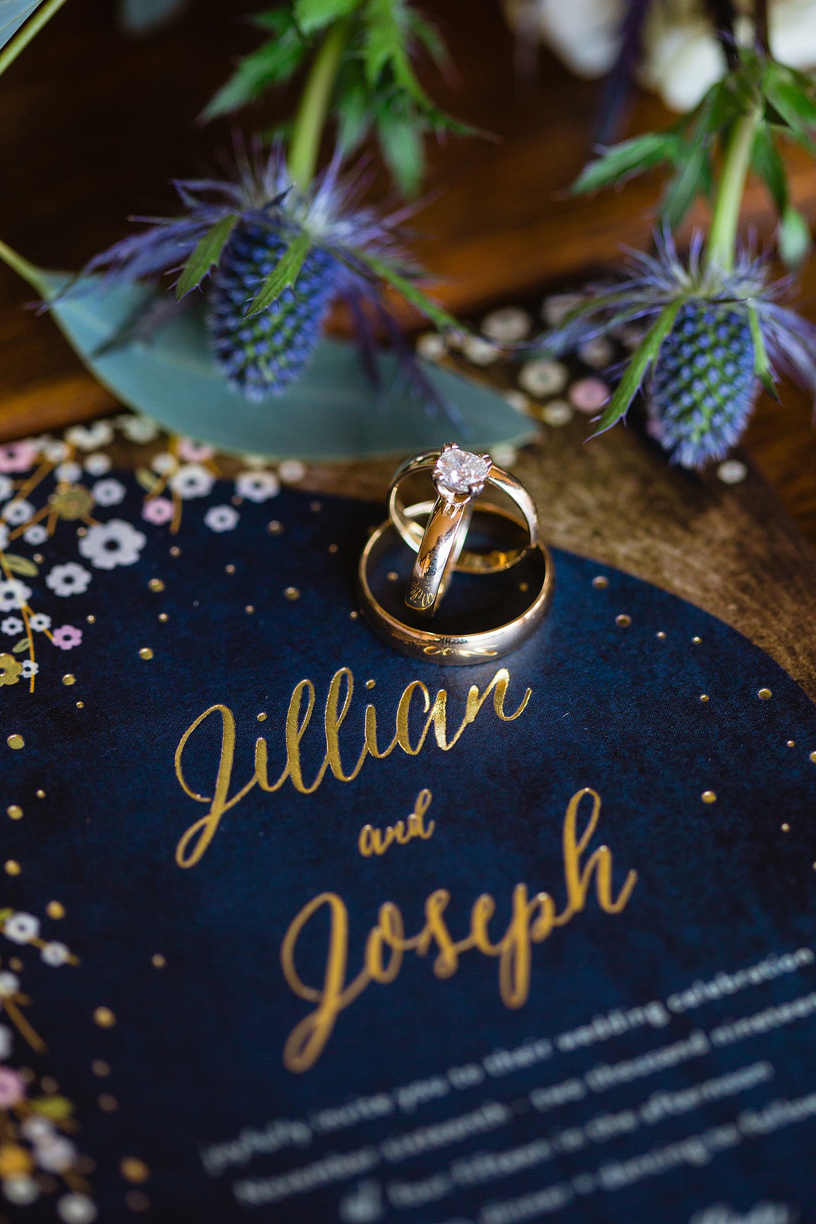 Romantic gold and navy wedding invitation with simple gold matching wedding rings by Phoenix wedding photographer PMA Photography.