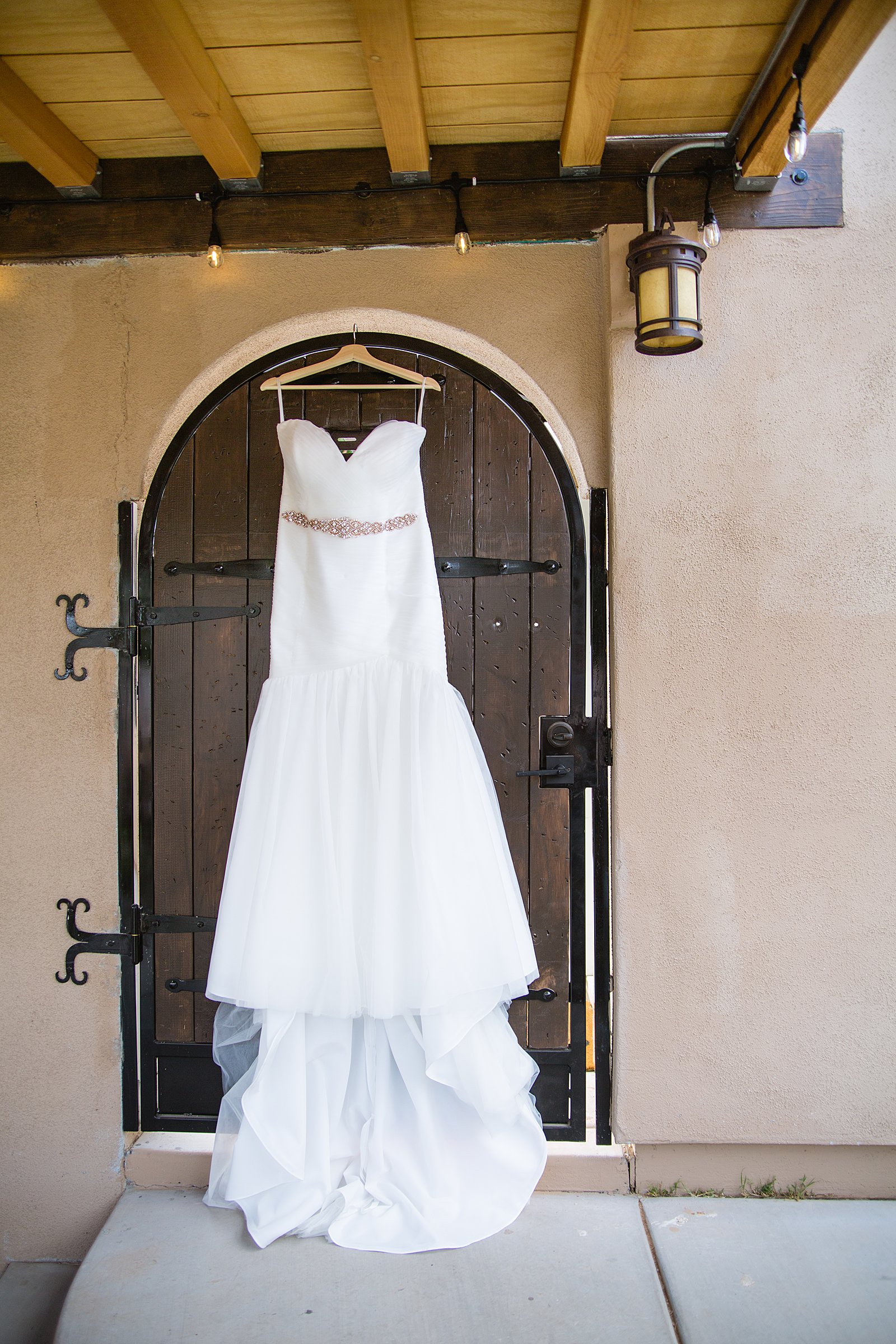 Bride's romantic mermaid wedding dress for her Arizona backyard wedding by PMA Photography.