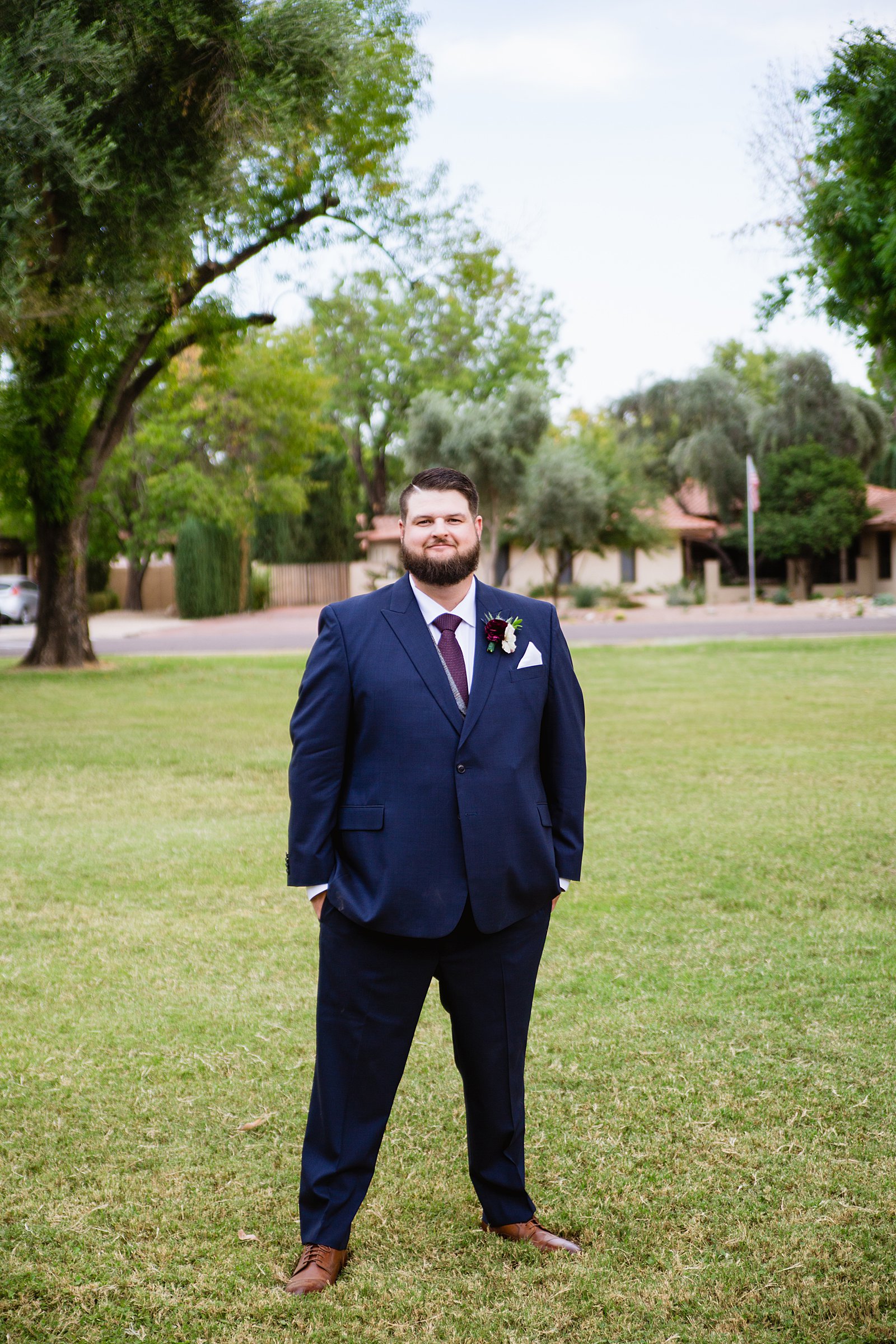 Groom's navy and maroon suit for his Arizona backyard wedding by PMA Photography.