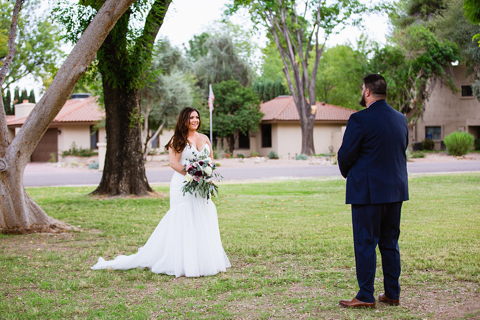 Bride and Groom's first look at Arizona backyard by Phoenix wedding photographer PMA Photography.