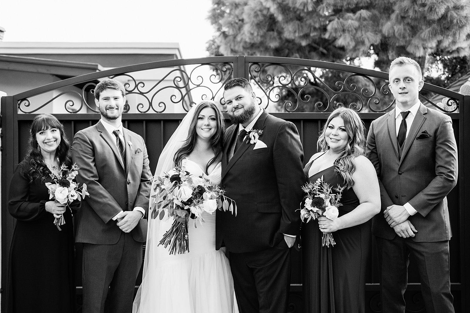 Bridal party together at a Arizona backyard wedding by Arizona wedding photographer PMA Photography.