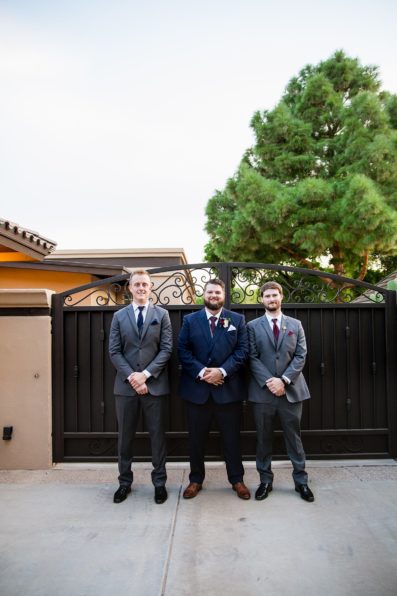Groom and groomsmen together at a Arizona backyard wedding by Arizona wedding photographer PMA Photography.