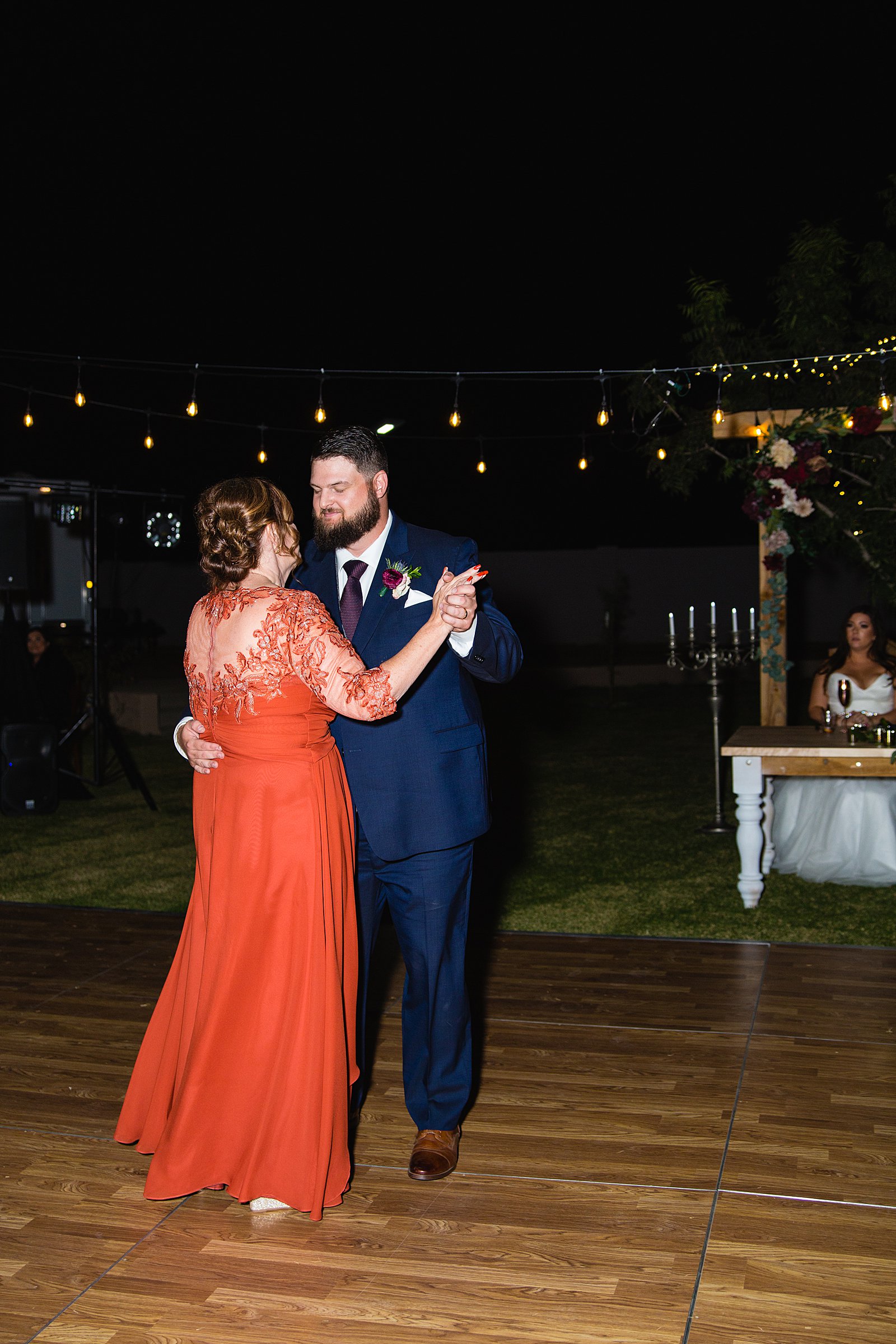 Mother son dance at an Arizona backyard wedding reception by Arizona wedding photographer PMA Photography.