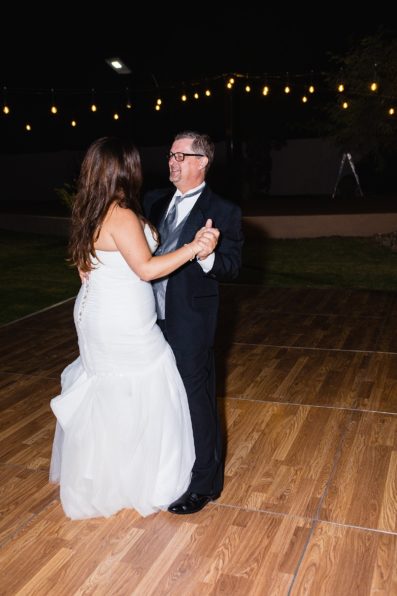 Father daughter dance at an Arizona backyard wedding reception by Arizona wedding photographer PMA Photography.