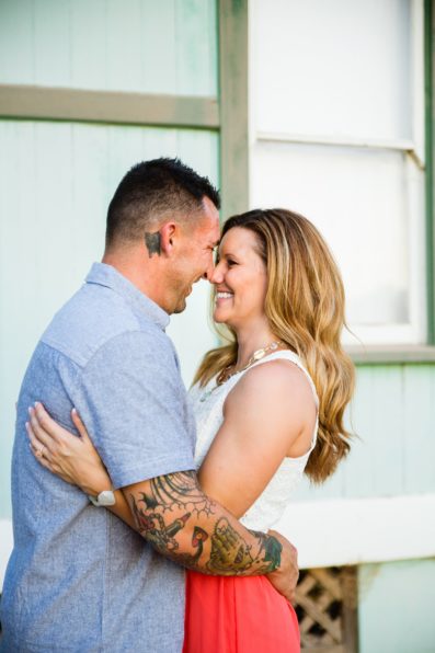 Couple share an intimate moment at their Chandler engagement session by Arizona engagement photographer PMA Photography.