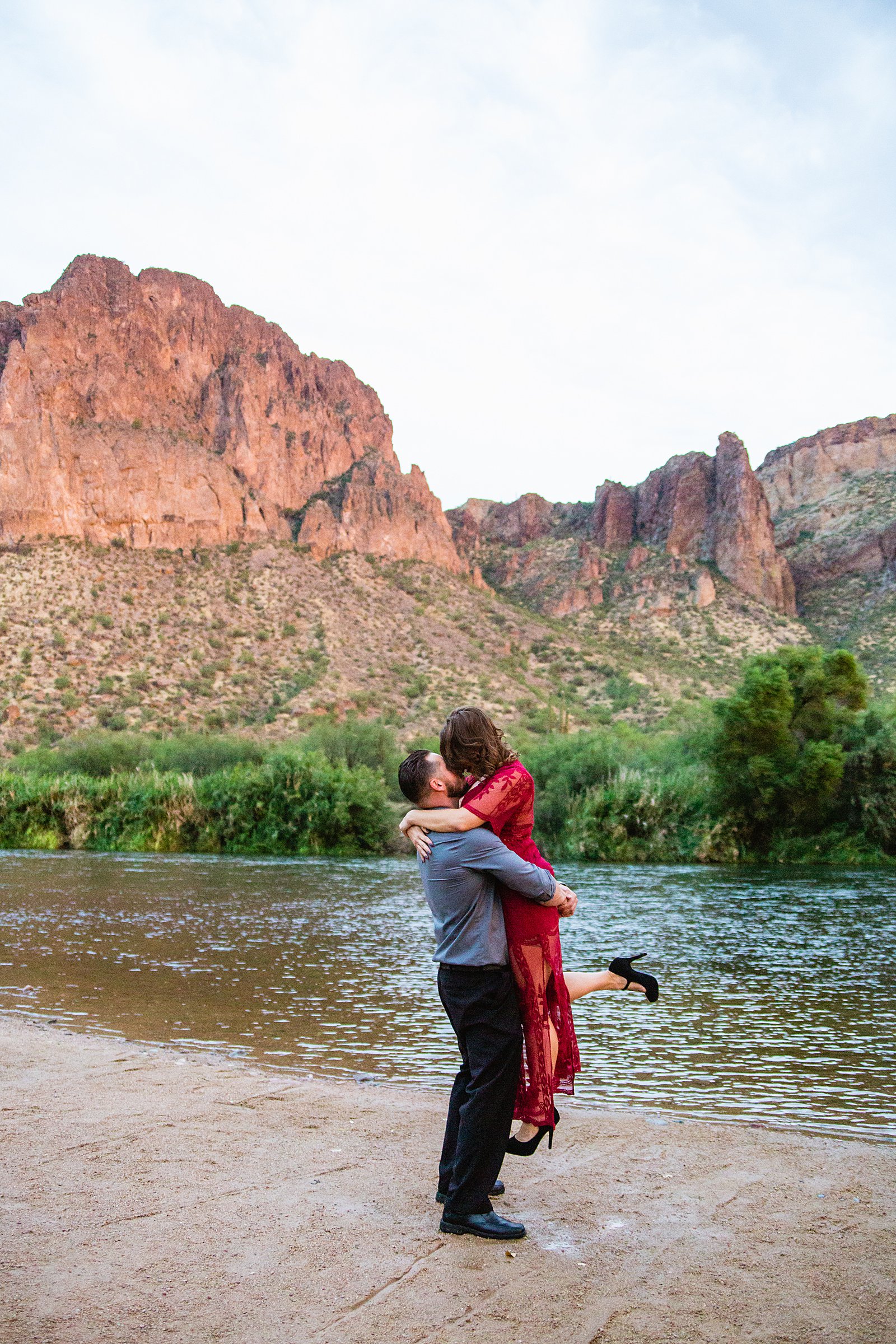 Couple share an intimate moment at their Phoenix engagement session by Arizona engagement photographer PMA Photography.