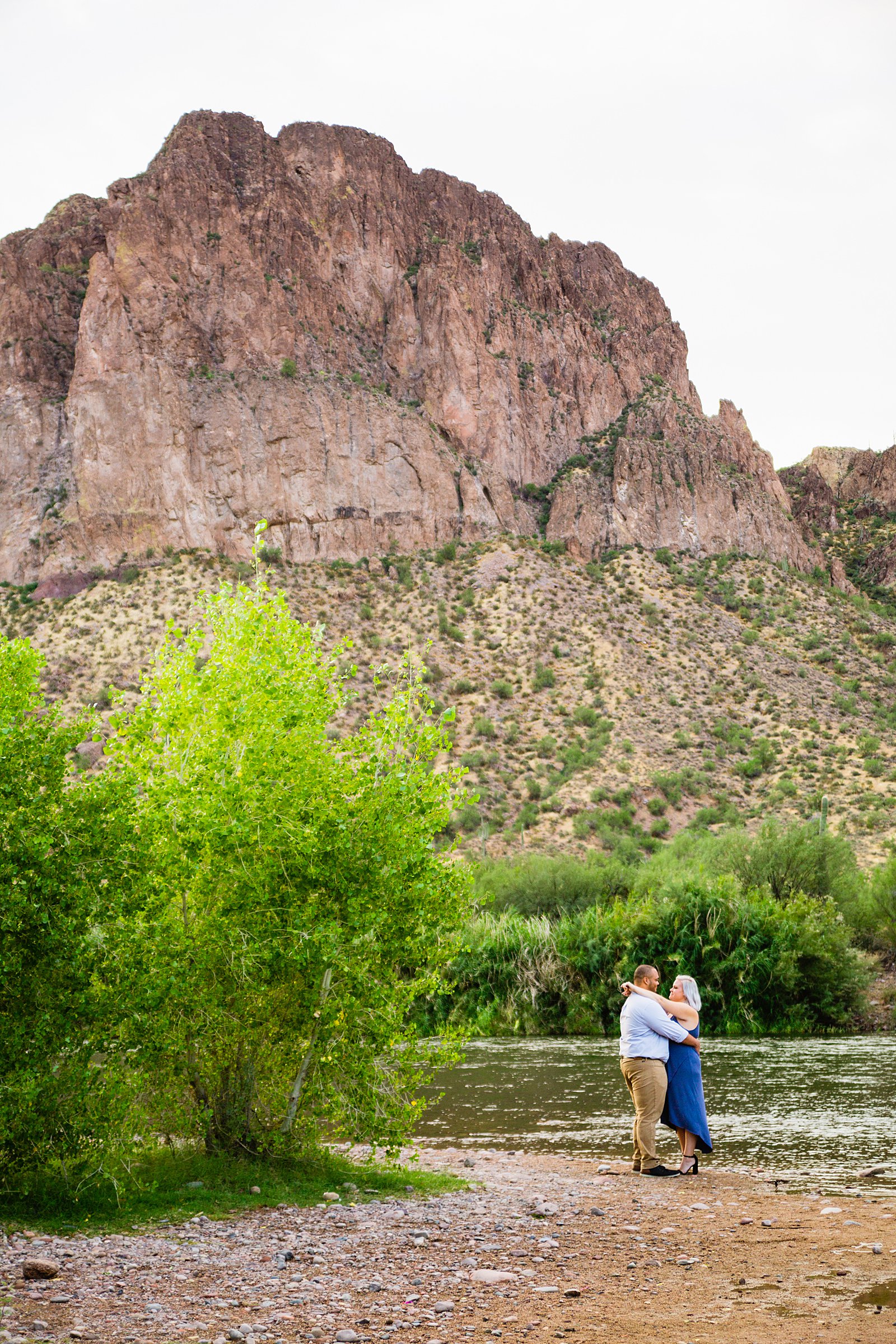 Adventurous couple pose for their Salt River engagement session by Phoenix wedding photographer PMA Photography.