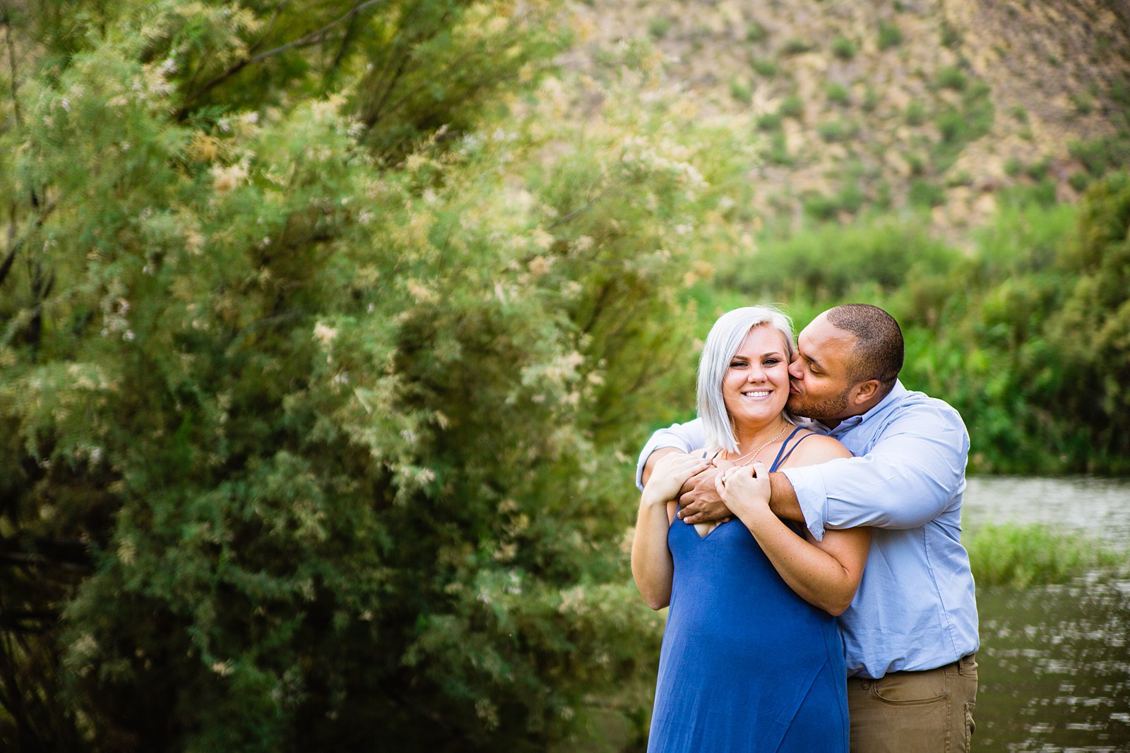 Couple share an intimate moment during their Salt River engagement session by Phoenix engagement photographer PMA Photography.
