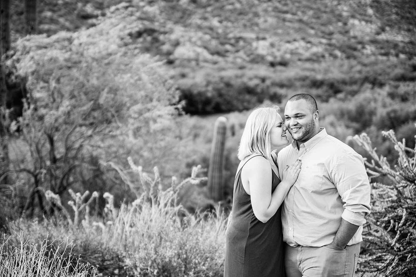 Couple laugh together during their Salt River engagement session by Phoenix engagement photographer PMA Photography.