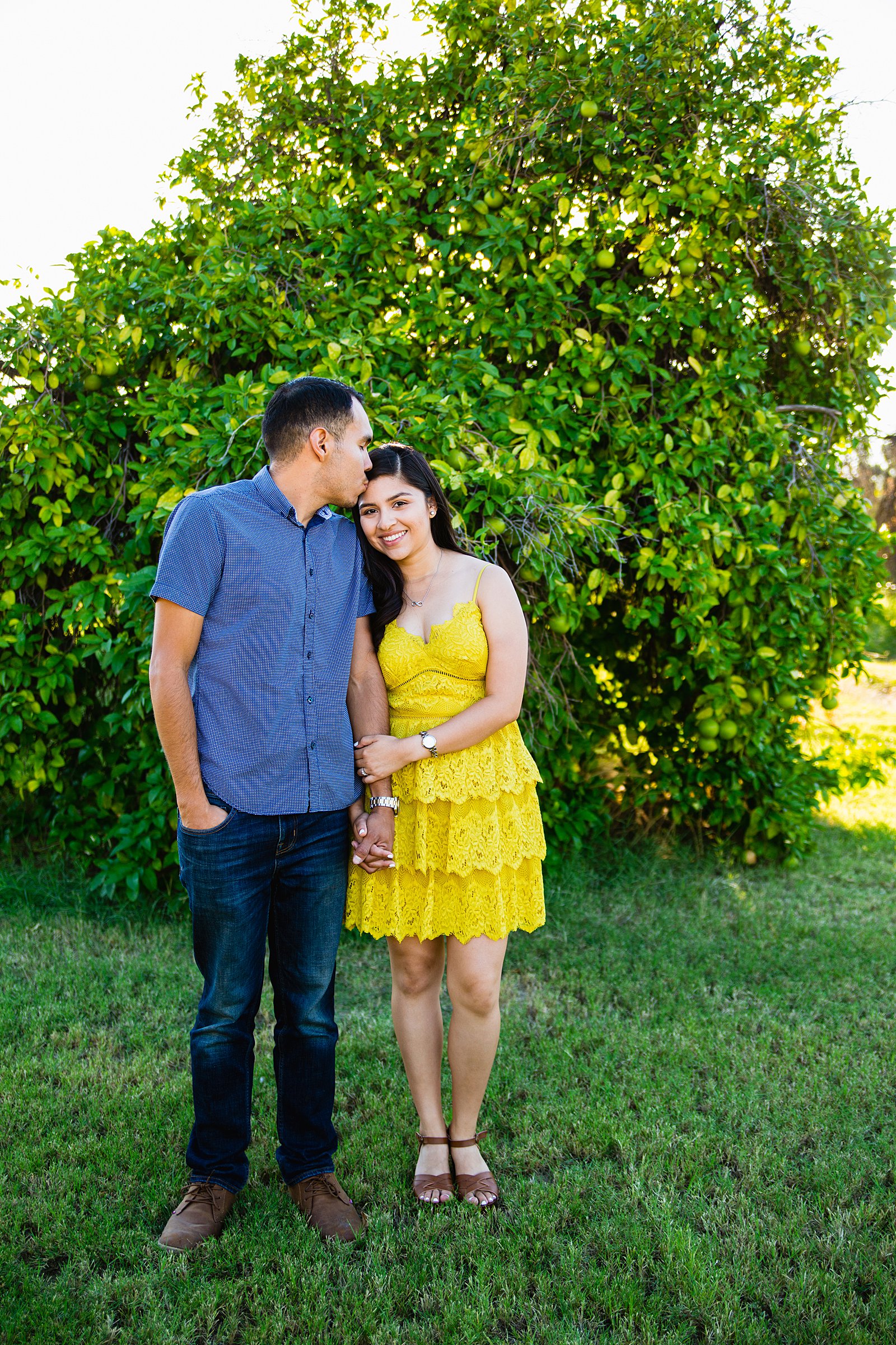 Couple pose for their Sahuaro Ranch engagement session by Glendale wedding photographer PMA Photography.