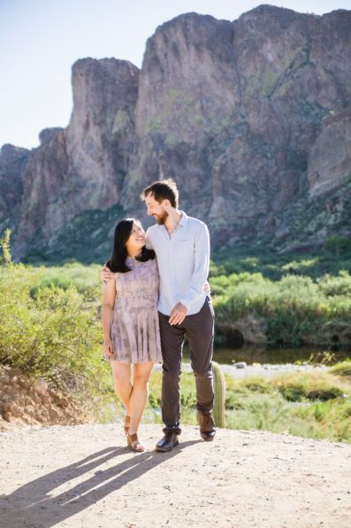 Couple walking together during their Salt River engagement session by Phoenix engagement photographer PMA Photography.