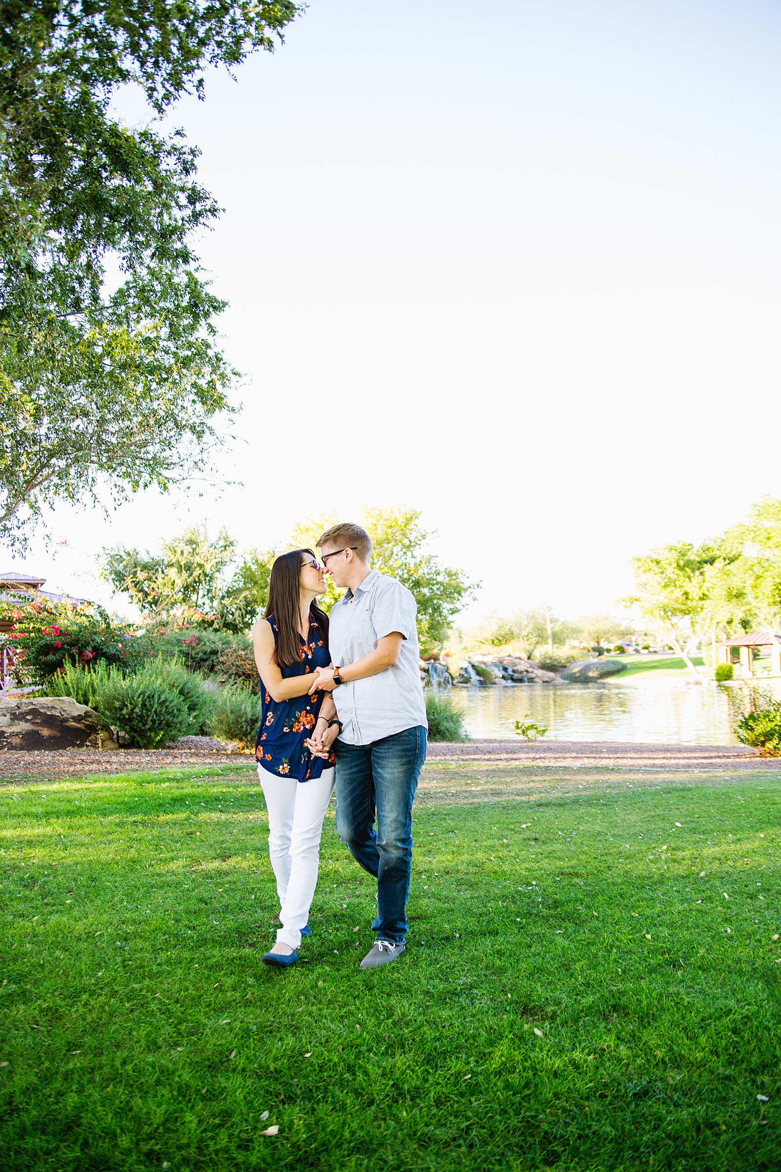 Couple walking together during their Anthem Park engagement session by Phoenix engagement photographer PMA Photography.