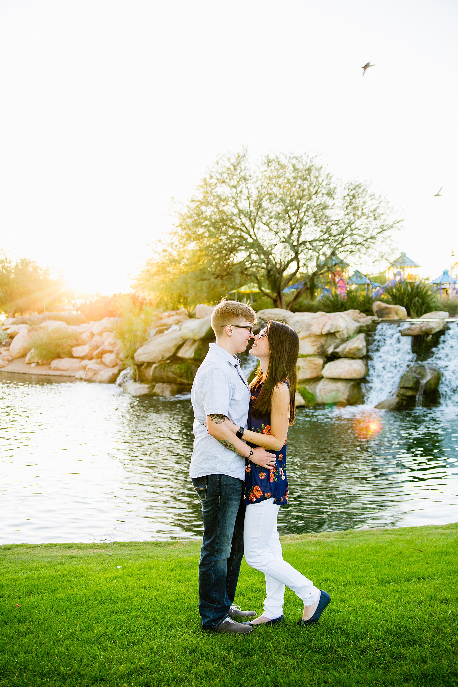 Couple share an intimate moment during their Anthem Park engagement session by Phoenix engagement photographer PMA Photography.