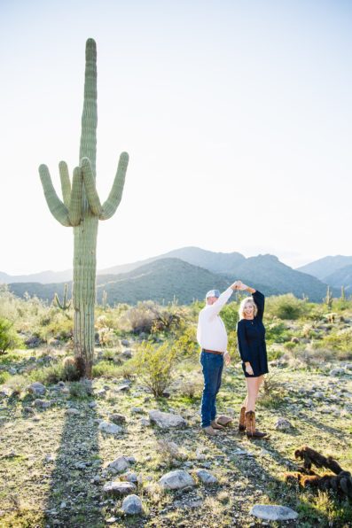 Couple dance together during their Phoenix engagement session by Arizona engagement photographer PMA Photography.