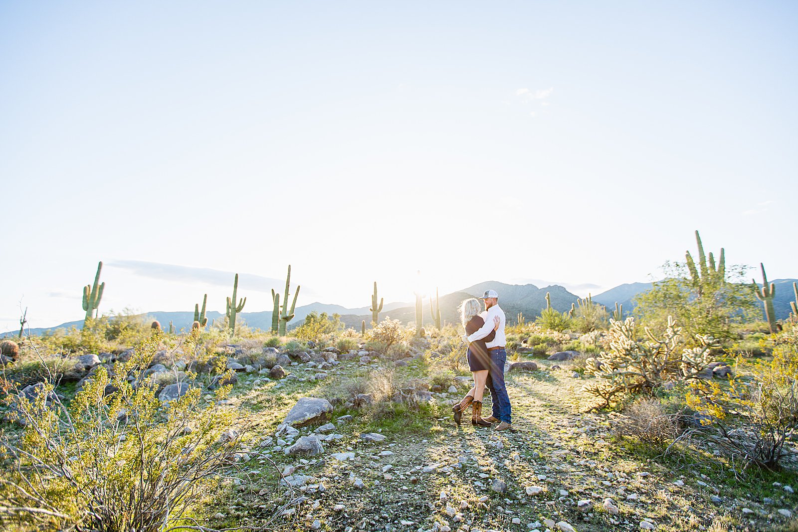 Couple pose for their White Tanks engagement session by Phoenix wedding photographer PMA Photography.
