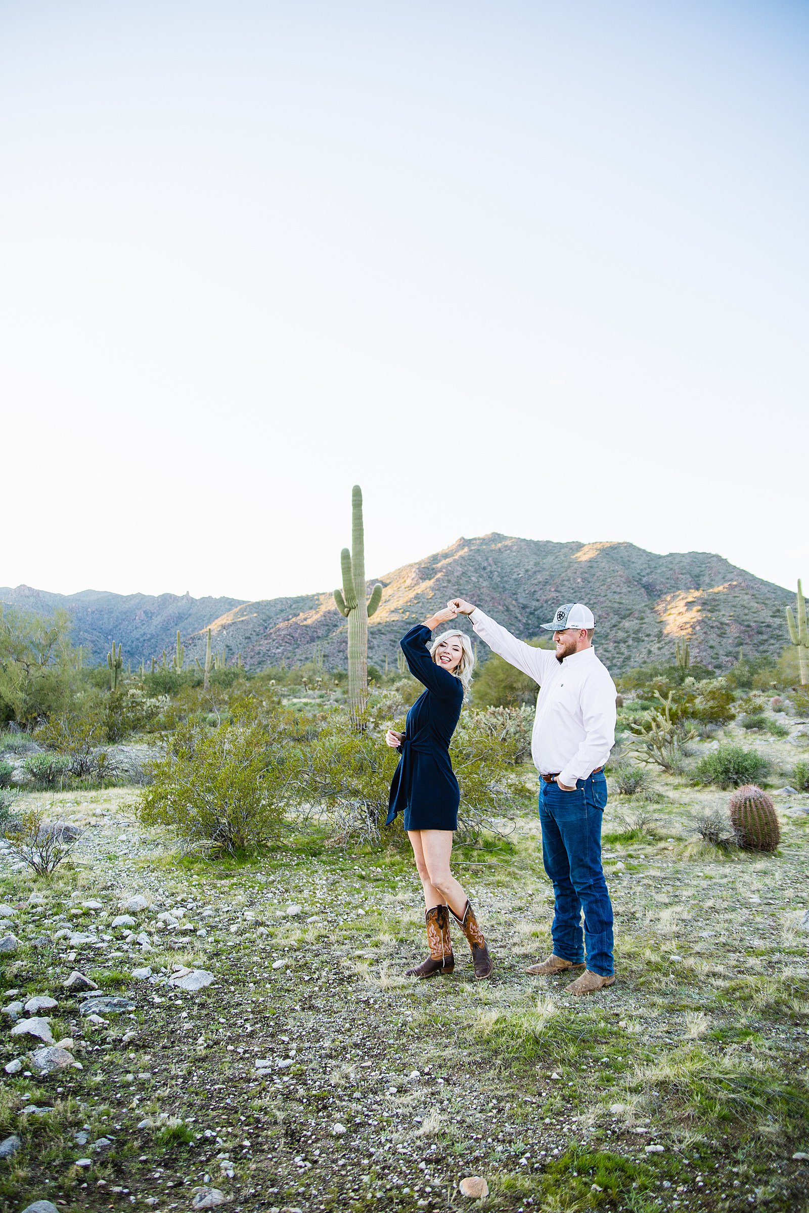 Couple dance together during their Phoenix engagement session by Arizona engagement photographer PMA Photography.