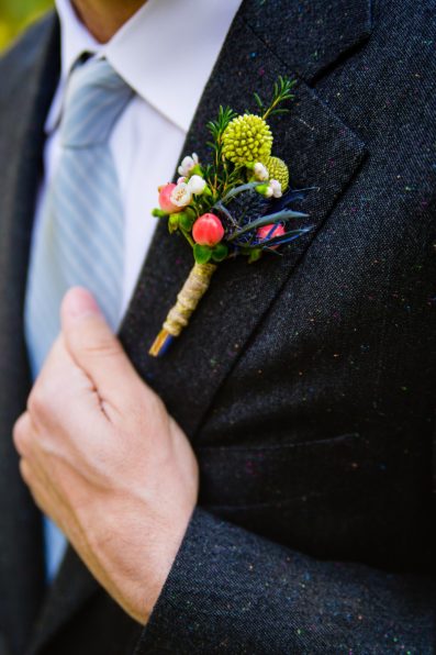 Groom's bold and colorful boutonniere by PMA Photography.