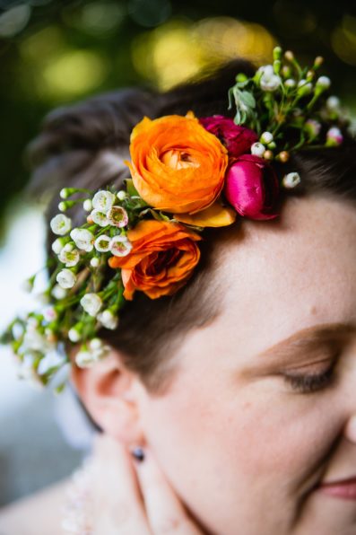 Bride's cold and colorful hair florals by PMA Photography.
