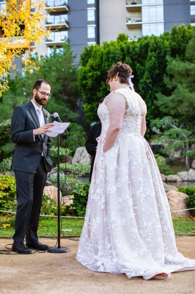 Groom reading his vows to the bride during their wedding ceremony at Japanese Friendship Garden by Phoenix wedding photographer PMA Photography.
