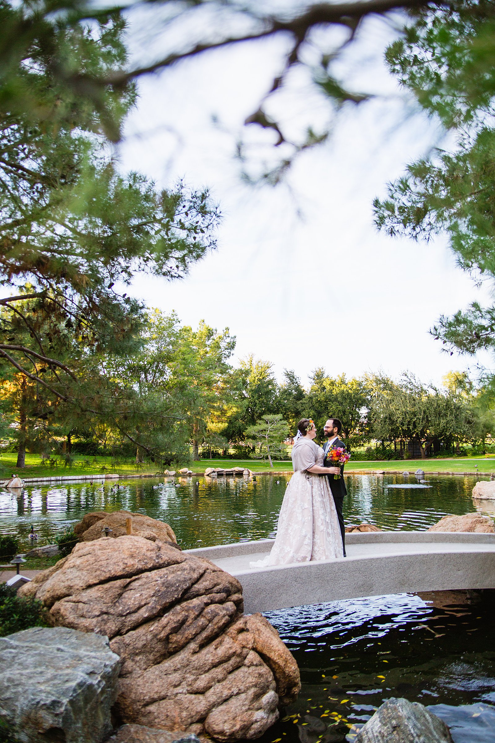 Bride and Groom pose for their Japanese Friendship Garden wedding by Phoenix wedding photographer PMA Photography.
