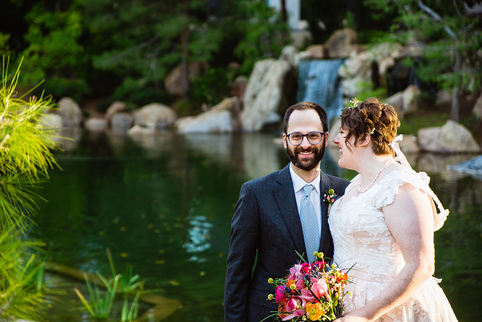 Bride and Groom laughing together during their Japanese Friendship Garden wedding by Arizona wedding photographer PMA Photography.