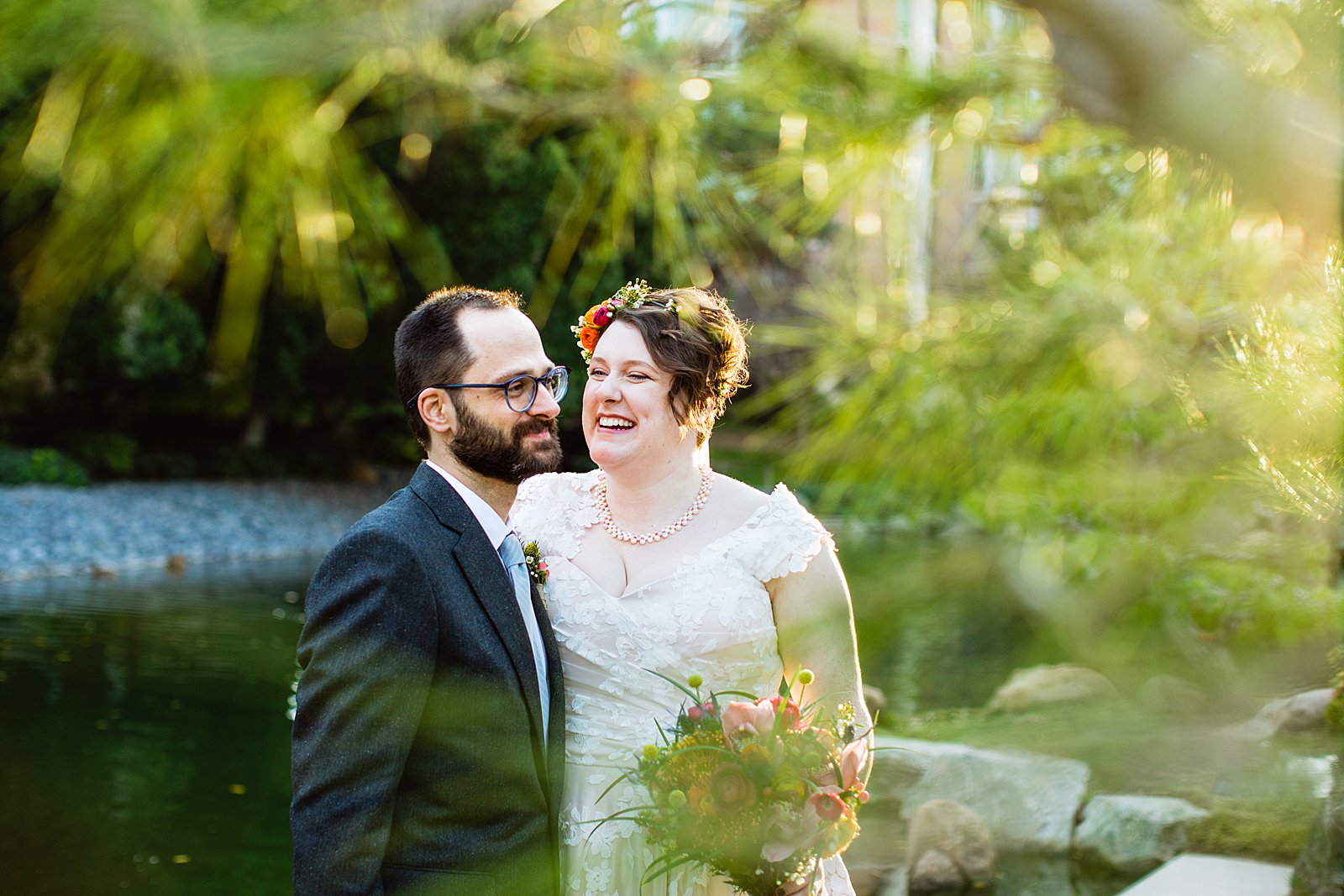 Bride and Groom laughing together during their Japanese Friendship Garden wedding by Phoenix wedding photographer PMA Photography.