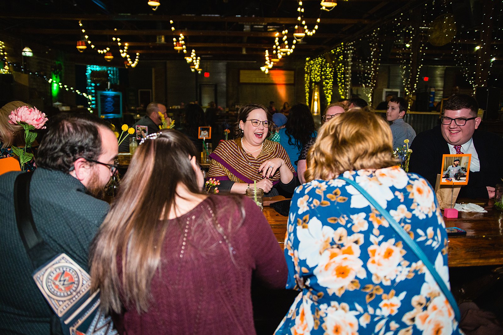 Guests mingling and laughing together at a low key wedding reception at The Duce by PMA Photography.