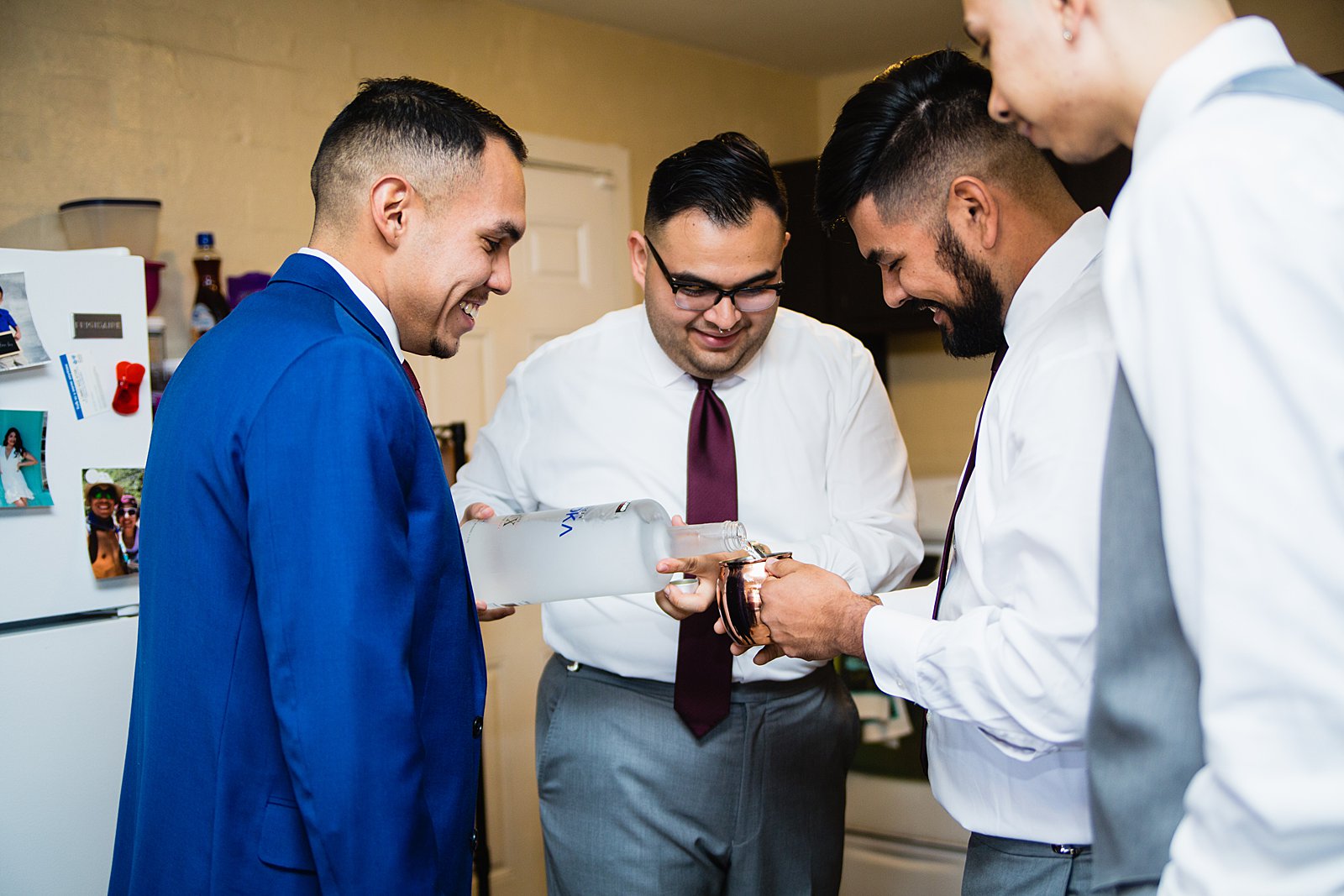Groom and groomsmen sharing shots together before his Valley Garden Center wedding by PMA Photography.